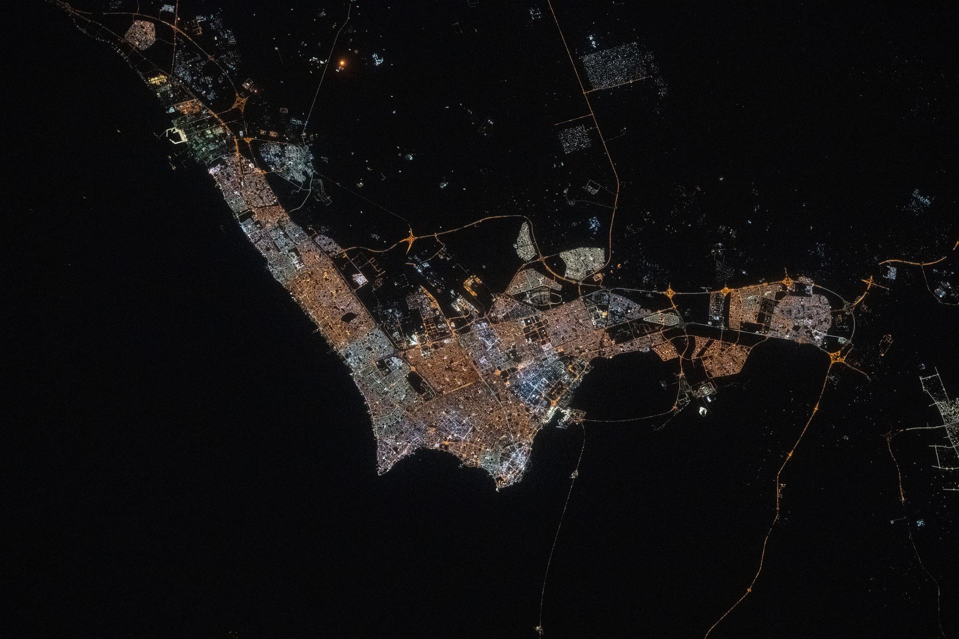 Kuwait City, with a population of about 3.5 million and where the majority of Kuwait's citizens reside on the Persian Gulf coast, is pictured at approximately 10:42 p.m. local time from the International Space Station as it orbited 259 miles above the Middle East.