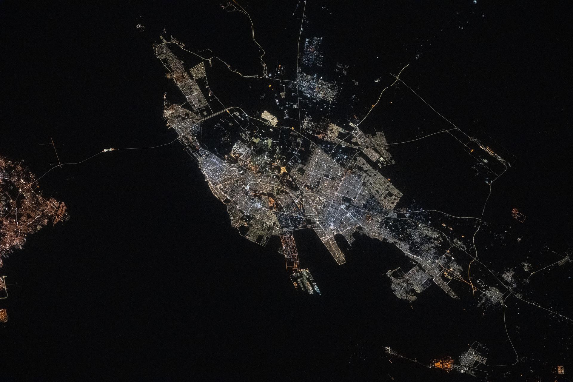 The port city of Dammam, Saudi Arabia, with a population of about 1.38 million on the Persian Gulf coast, is pictured at approximately 10:43 p.m. local time from the International Space Station as it orbited 259 miles above the Middle East.