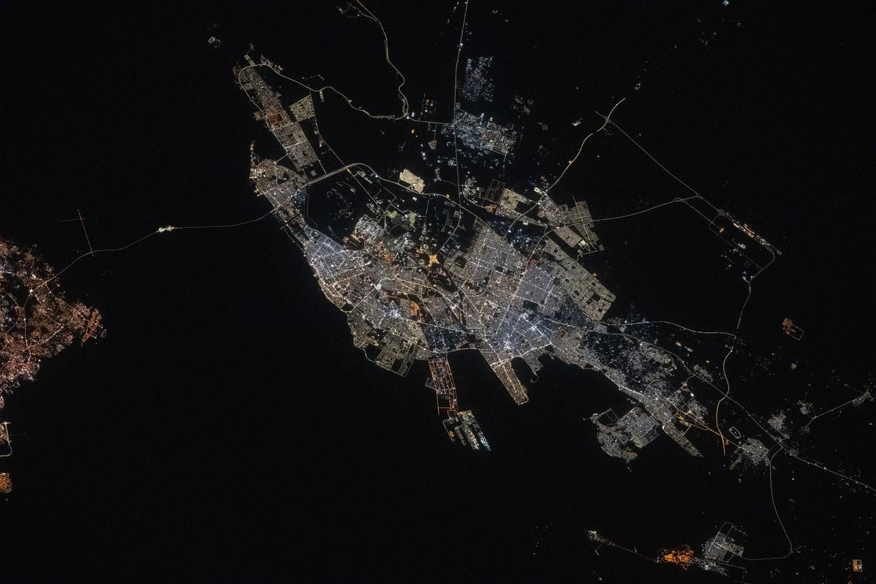 iss073e0134562 (May 22, 2025) --- The port city of Dammam, Saudi Arabia, with a population of about 1.38 million on the Persian Gulf coast, is pictured at approximately 10:43 p.m. local time from the International Space Station as it orbited 259 miles above the Middle East.