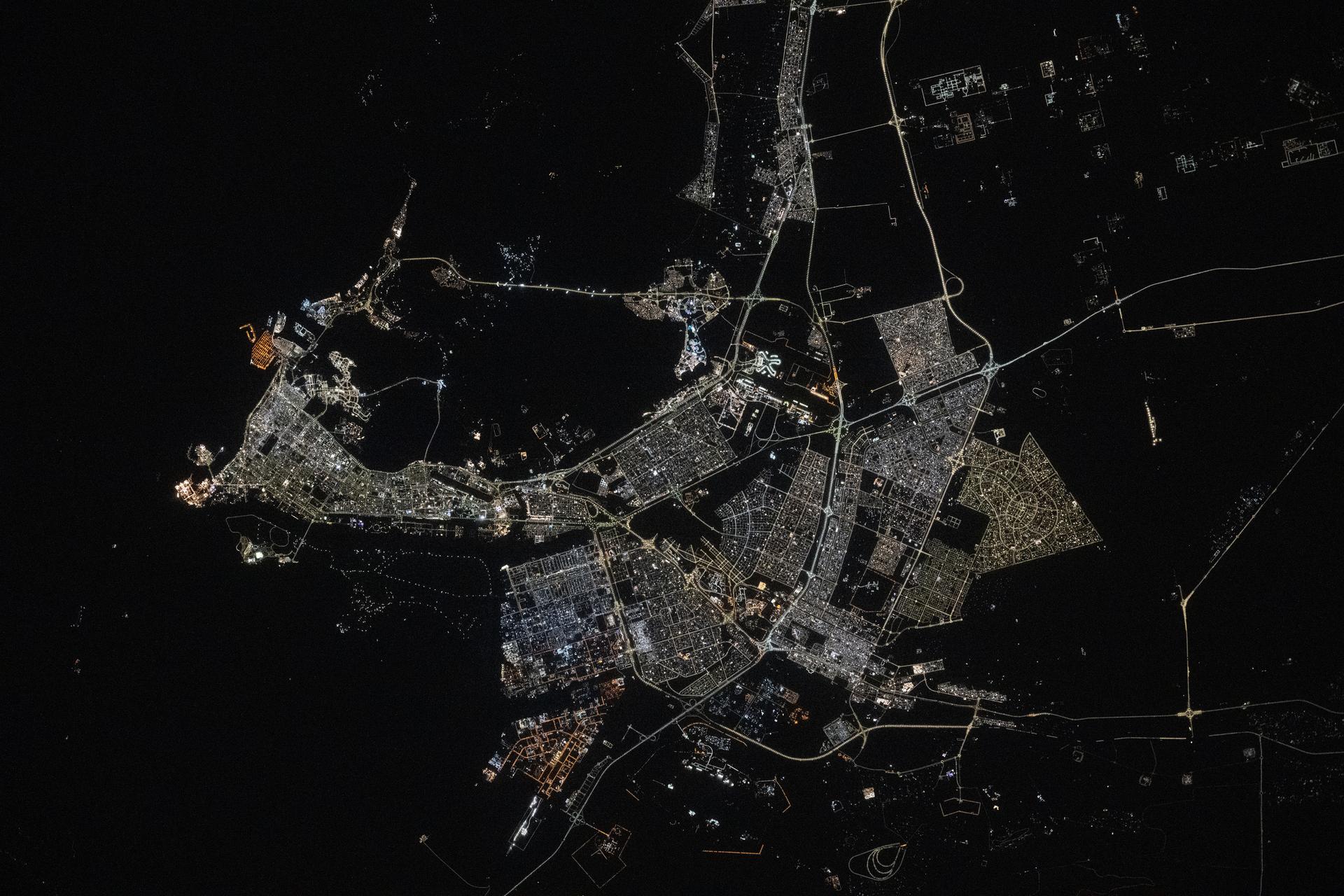 Abu Dhabi, the capital and second most populous city in the United Arab Emirates with a population of about 1.57 million on the Persian Gulf, is pictured at approximately 10:44 p.m. local time from the International Space Station as it orbited 259 miles above the Middle East.