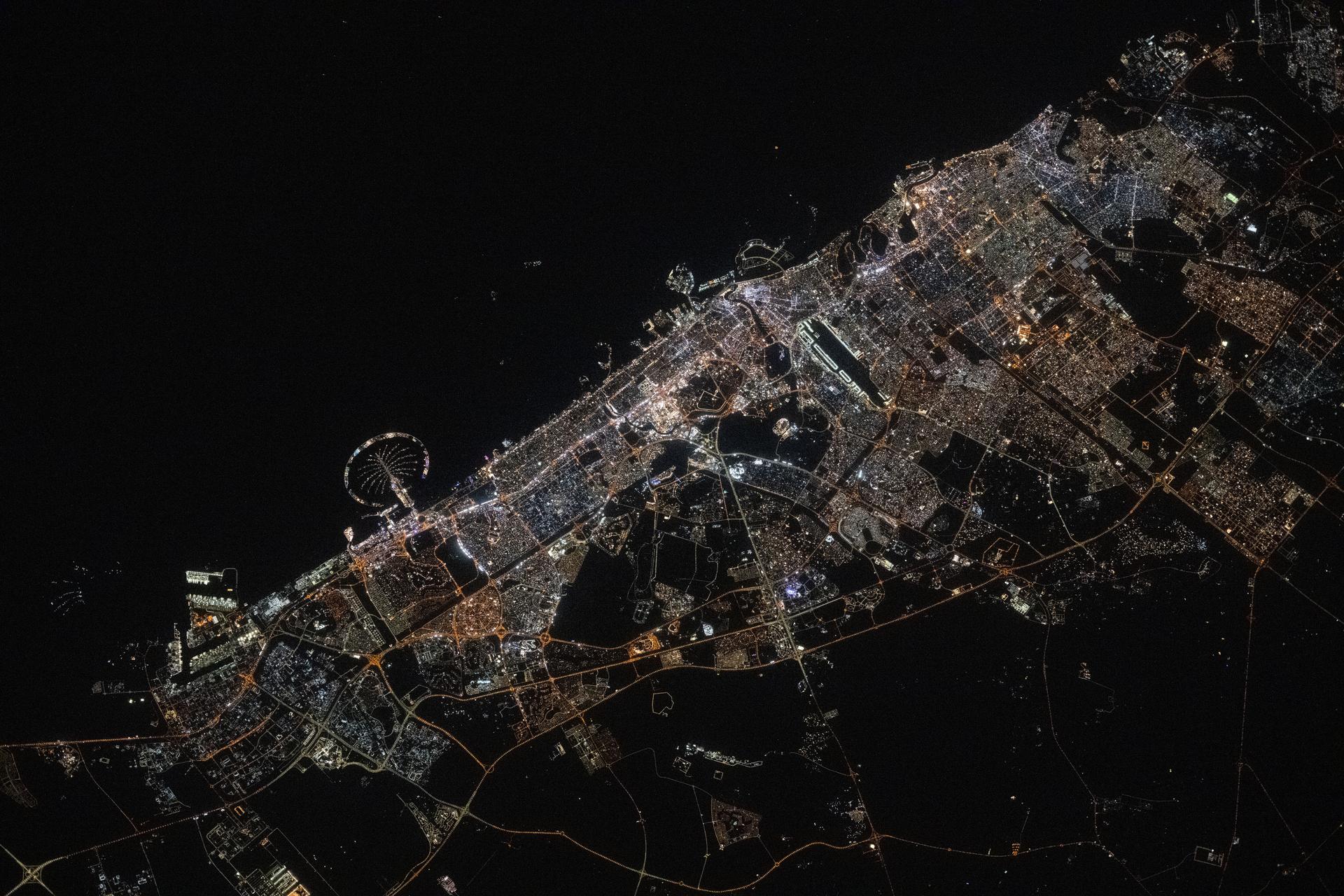Dubai, the United Arab Emirates' largest city with a population af 3.94 million on the Persian Gulf coast, is pictured at approximately 11:44 p.m. local time from the International Space Station as it orbited 259 miles above the Arabian Peninsula. Featured prominently at left center, is the artifical island of Palm Jumeirah.