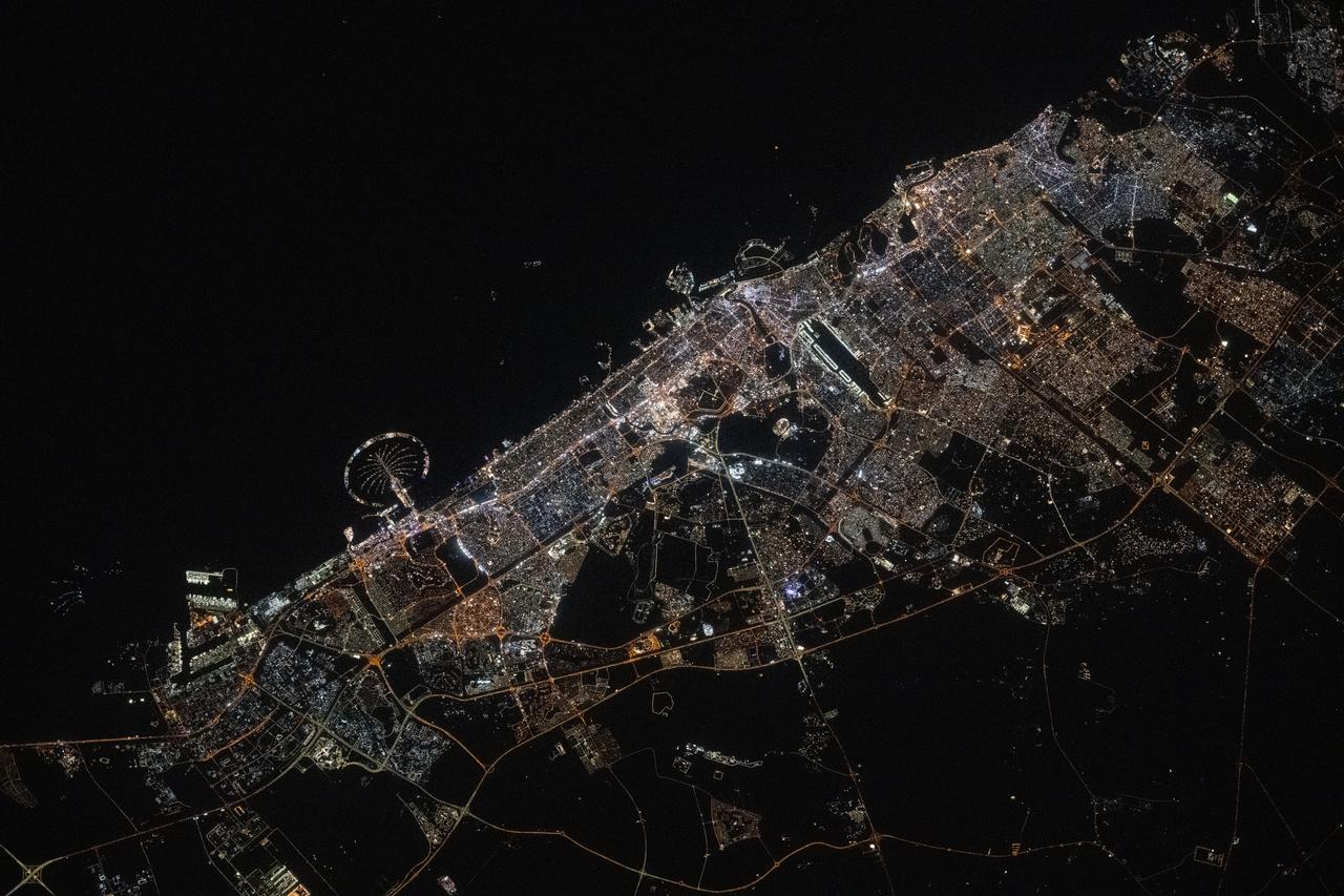 iss073e0134584 (May 22, 2025) --- Dubai, the United Arab Emirates' largest city with a population af 3.94 million on the Persian Gulf coast, is pictured at approximately 11:44 p.m. local time from the International Space Station as it orbited 259 miles above the Arabian Peninsula. Featured prominently at left center, is the artifical island of Palm Jumeirah.