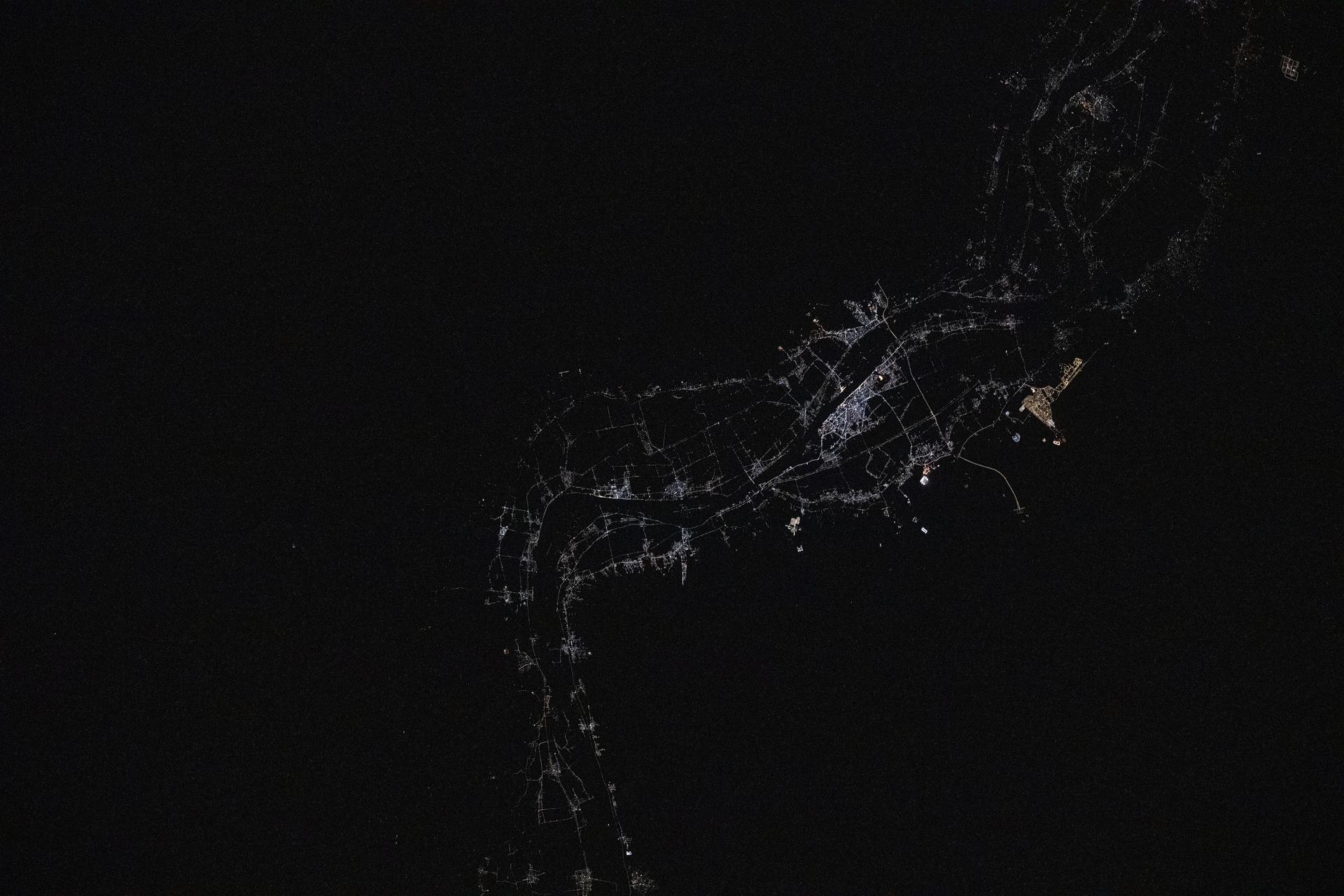 Luxor, a 4,000-year-old city in Egypt with a population of over 263,000, sits on the bank of the River Nile in this photograph taken at approximately 12:17 a.m. local time from the International Space Station as it orbited 259 miles above. Luxor, a popular tourist destination, was the ancient Egyptian city of Thebes and is also home to numerous landmarks such as The Valley of the Kings and The Valley of the Queens.