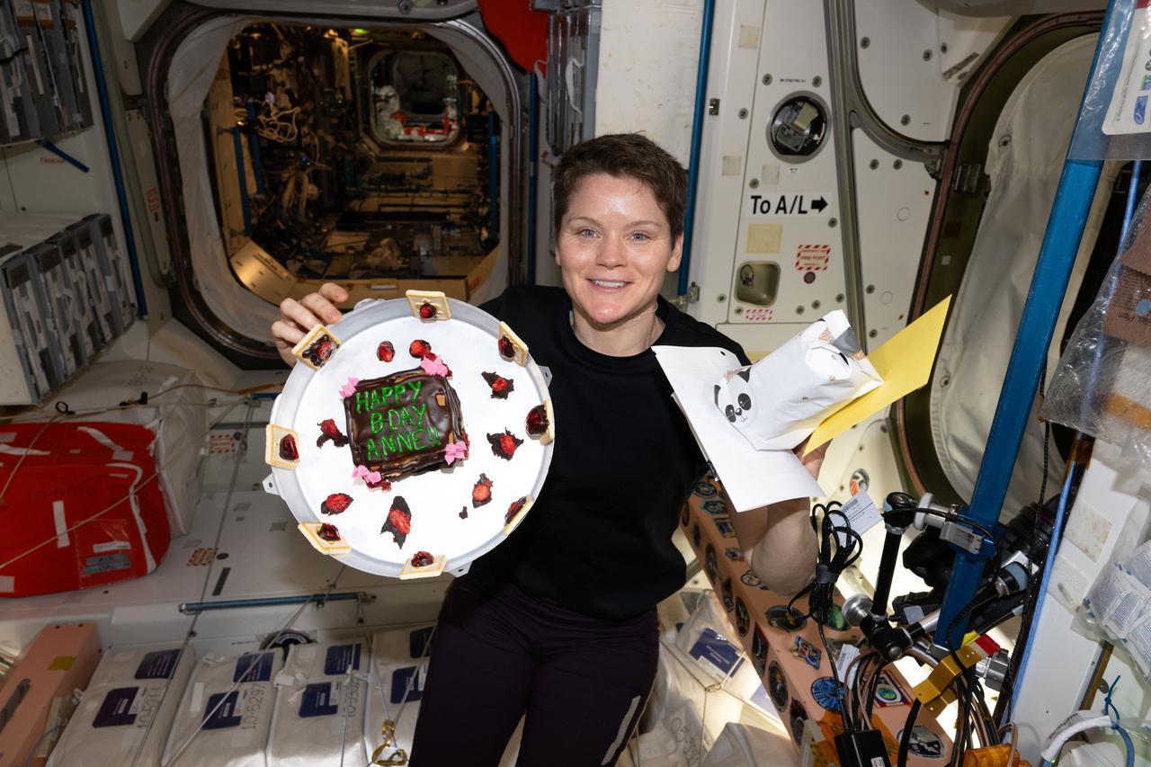 iss073e0134965 (June 7, 2025) --- NASA astronaut and Expedition 73 Flight Engineer Anne McClain celebrates her 46th birthday with a cake, gifts, and cards aboard the International Space Station's Unity module.