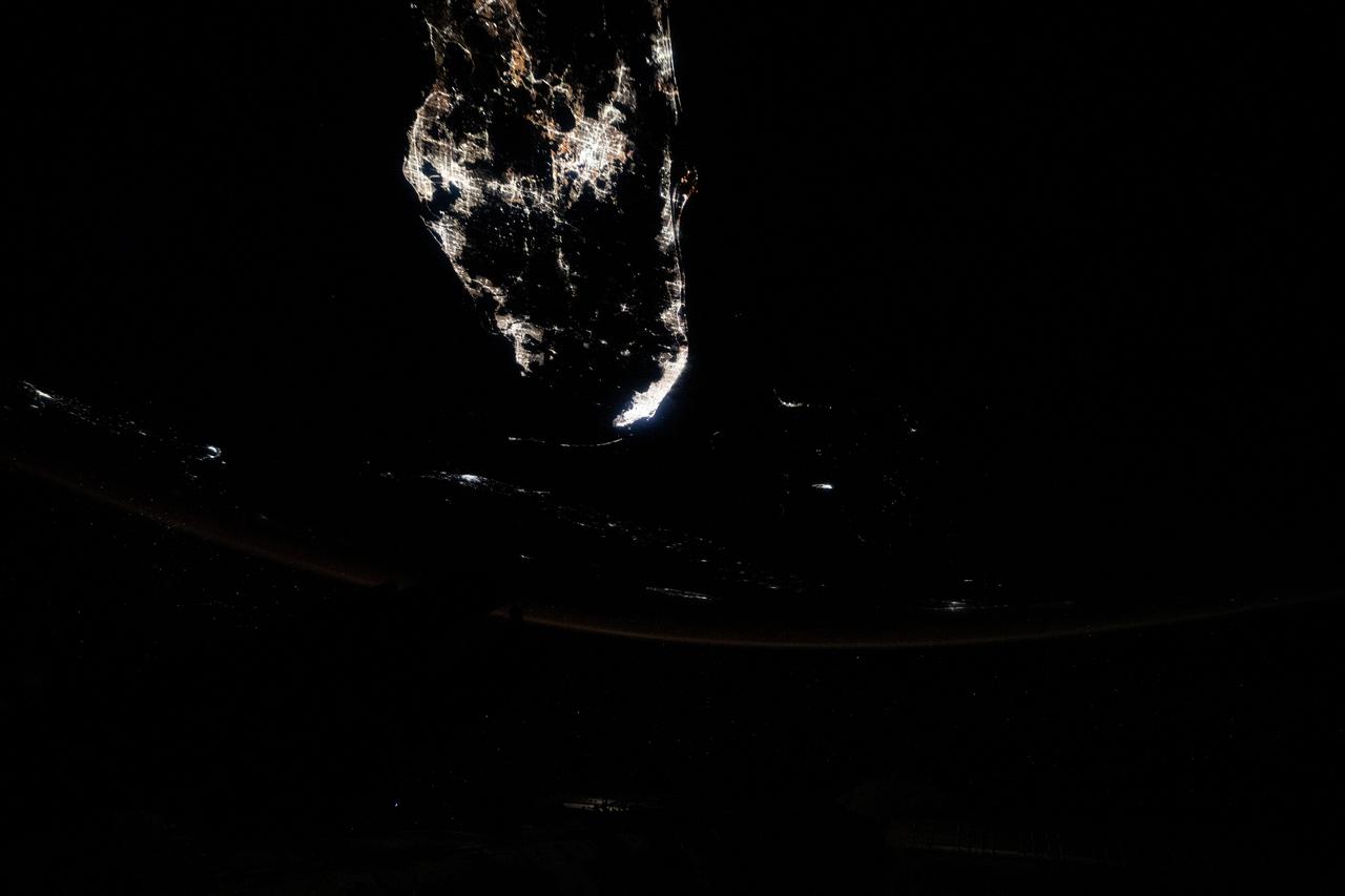 iss073e0149283 (May 21, 2025) --- Southern Florida's major urban areas of Tampa, Orlando, and Miami are pictured at approximately 1:01 a.m. local time from the International Space Station as it orbited 259 miles above the Atlantic Ocean.