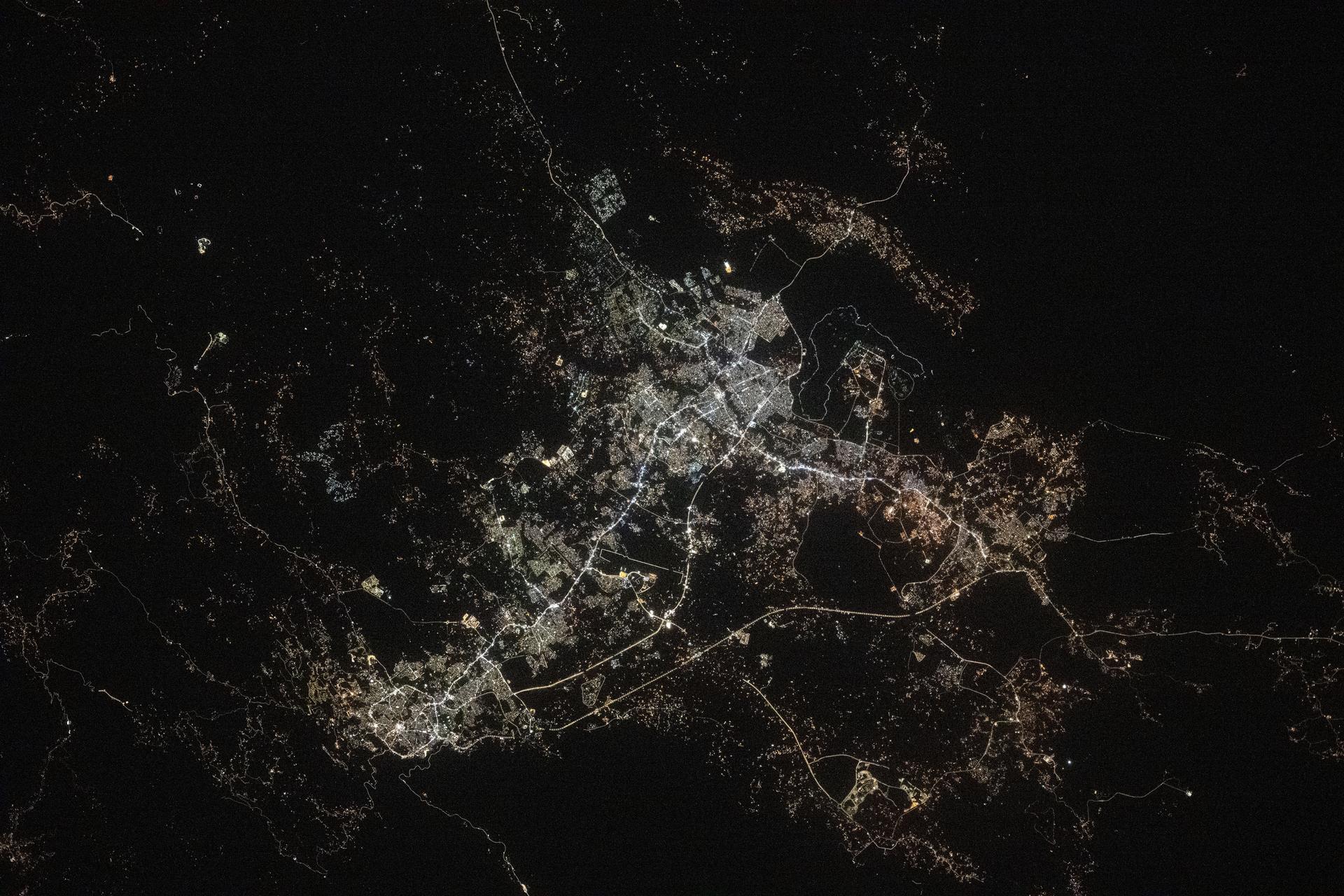 The Saudi Arabian cities of Abha (lower left) and Khamis Mushait (center) and their surrounding suburbs with a combined population of about 2.44 million are pictured at approximately 11:32 p.m. local time from the International Space Station as it orbited 259 miles above.