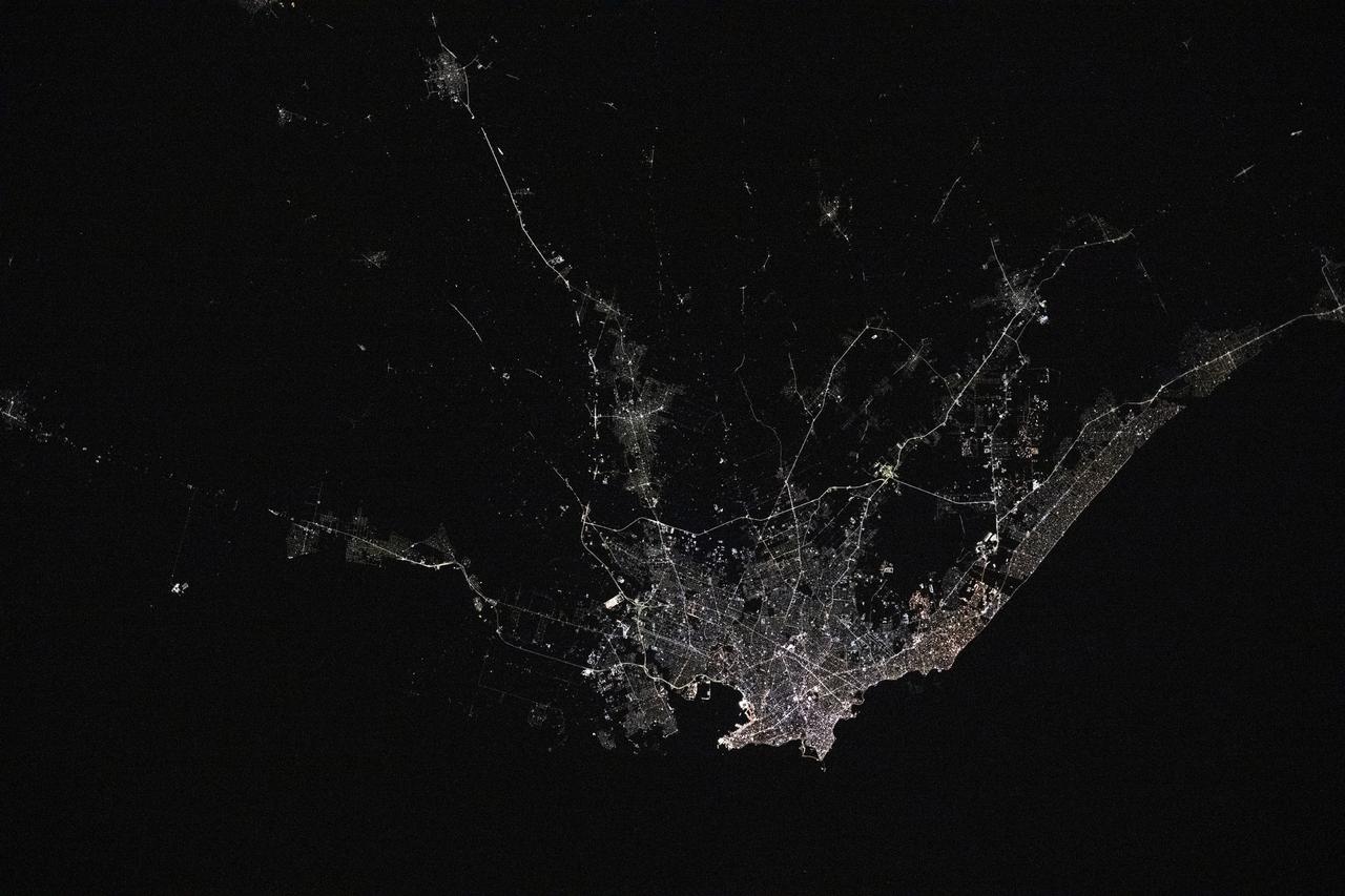 iss073e0176311 (May 20, 2025) --- Montevideo, Uruguay, the South American nation's capital and largest city with a population of about 1.28 million on the bank of the Rio de la Plata, is pictured at approximately 4:43 a.m. local time from the International Space Station as it orbited 267 miles above.