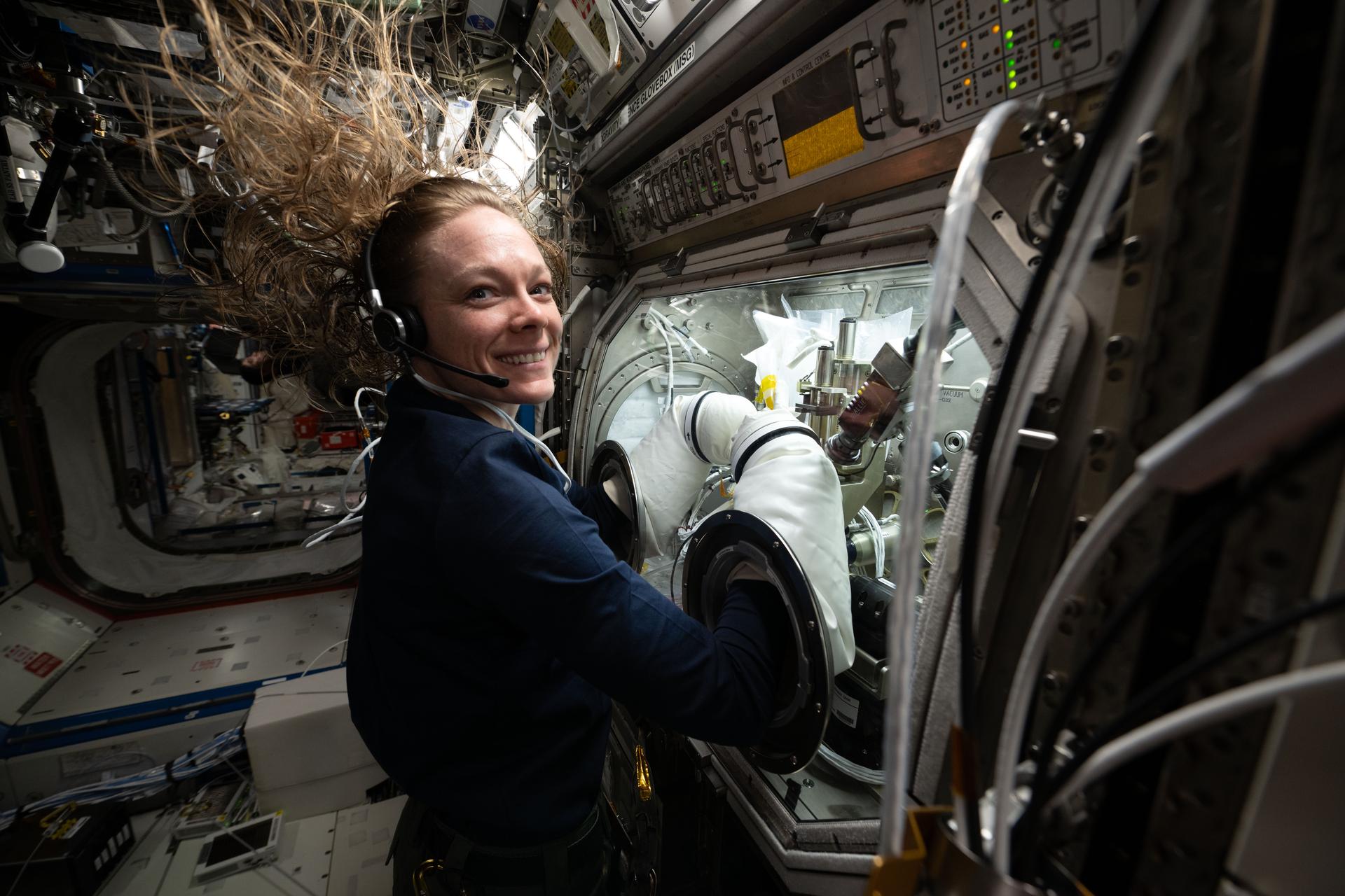 NASA astronaut and Expedition 73 Flight Engineer Nichole Ayers conducts research operations inside the Destiny laboratory module's Microgravity Science Glovebox aboard the International Space Station. Ayers swapped syringes containing protein samples and installed test cells inside the glovebox for the Ring-Sheared Drop Interfacial Bioprocessing of Pharmaceuticals investigation that explores using surface tension to contain liquids and study proteins without contacting solid walls. Results may benefit pharmaceutical manufacturing and 3D printing techniques on and off the Earth.