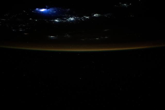 NASA image: Lightning illuminates the clouds above Southeast Asia