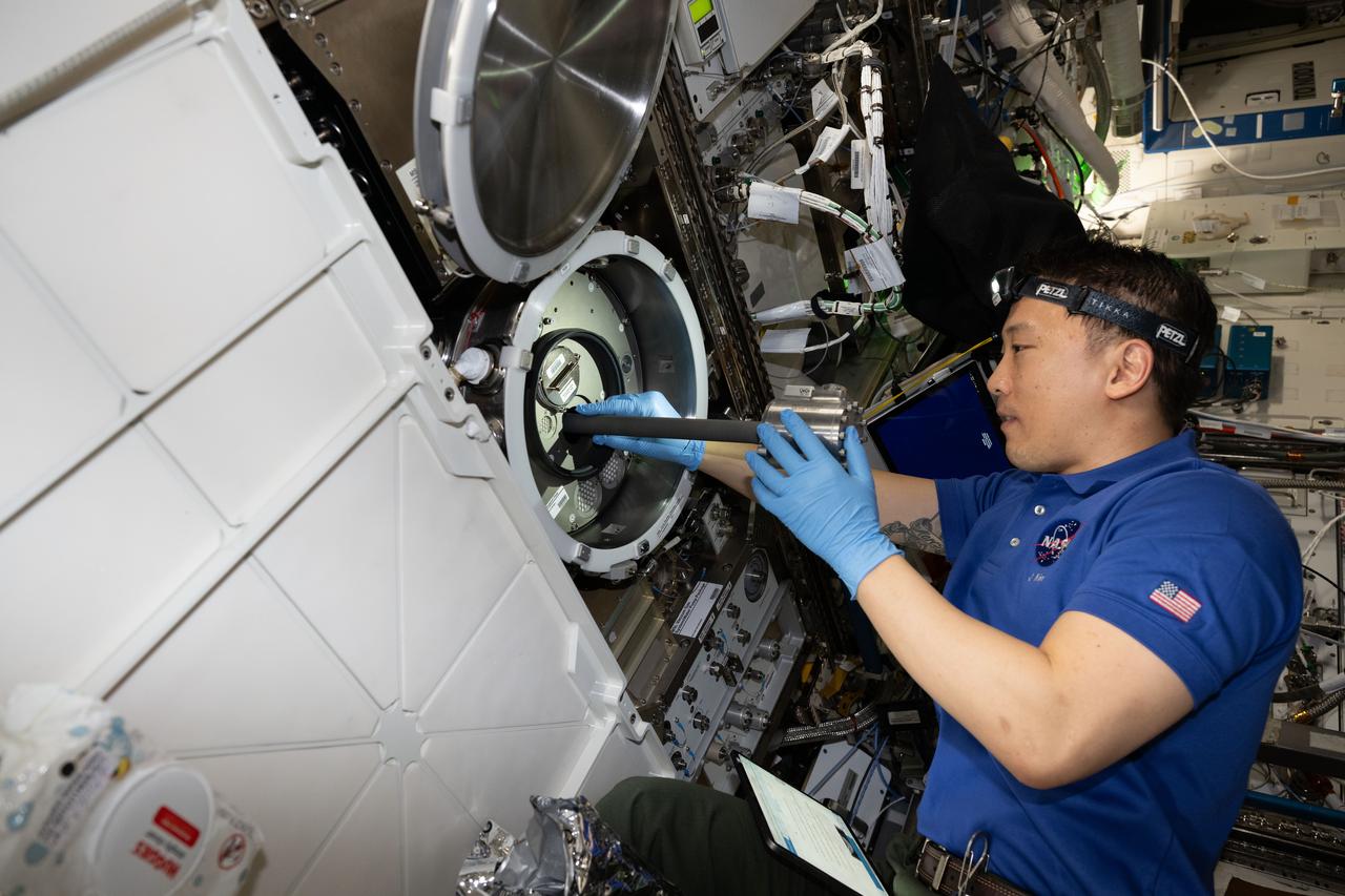iss073e0222456 (June 27, 2025) --- NASA astronaut and Expedition 73 Flight Engineer Jonny Kim removes research hardware from inside the Materials Science Laboratory (MSL) located inside the International Space Station's Destiny laboratory module. The MSL uses two different furnaces that operate one at a time to discover new applications for existing materials, such as metals, alloys, polymers, and new or improved materials.
