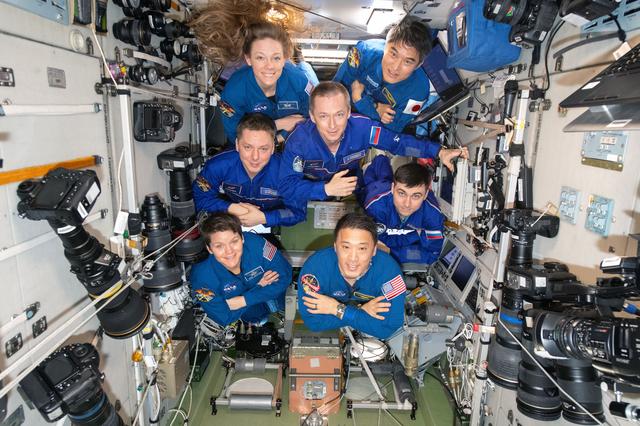NASA image: The seven-member Expedition 73 crew poses for a portrait