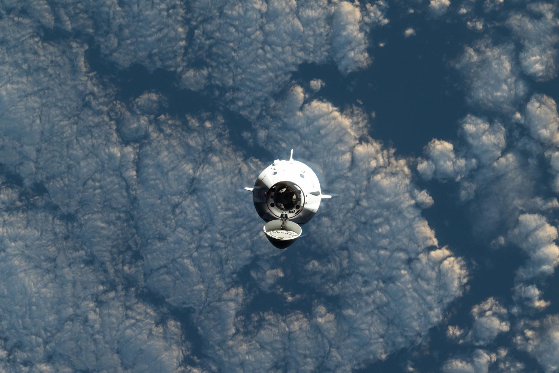 The SpaceX Dragon spacecraft carrying the Axiom Mission 4 (Ax-4) crew from Axiom Space approaches the International Space Station as both spacecraft were orbiting 268 miles above a cloudy southern Indian Ocean. Commanding Ax-4 inside Dragon was veteran astronaut Peggy Whitson leading Pilot Shubhanshu Shukla, and Mission Specialists Sławosz Uznański-Wiśniewski and Tibor Kapu. Dragon would dock later to the orbital outpost's space-facing port on the Harmony module.