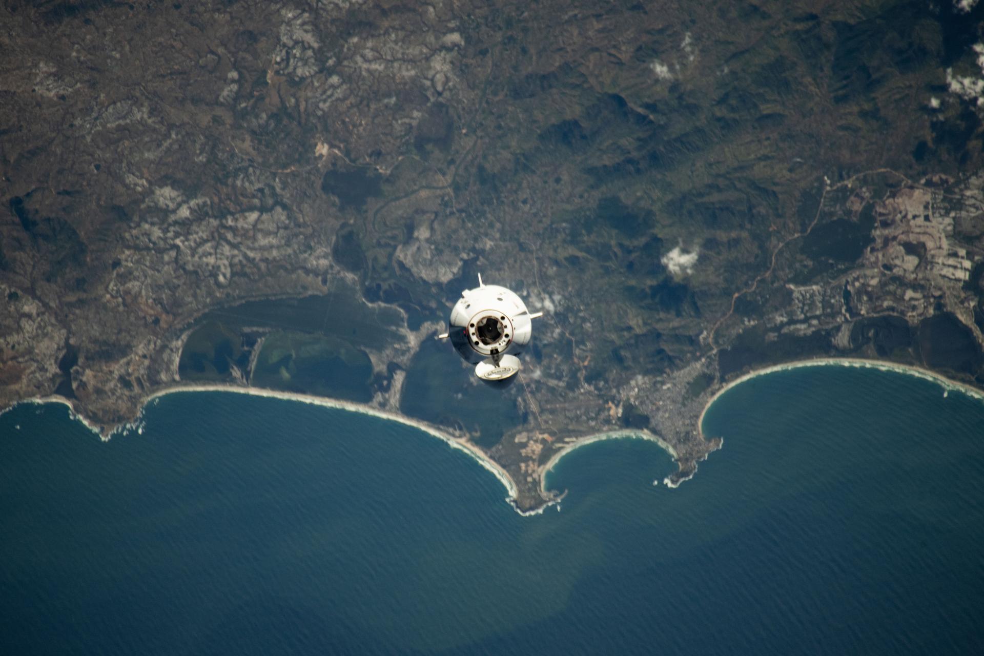 The SpaceX Dragon spacecraft carrying the Axiom Mission 4 (Ax-4) crew from Axiom Space approaches the International Space Station as both spacecraft were orbiting 263 miles above the coast of southern Madagascar. Commanding Ax-4 inside Dragon was veteran astronaut Peggy Whitson leading Pilot Shubhanshu Shukla, and Mission Specialists Sławosz Uznański-Wiśniewski and Tibor Kapu. Dragon would dock later to the orbital outpost's space-facing port on the Harmony module.