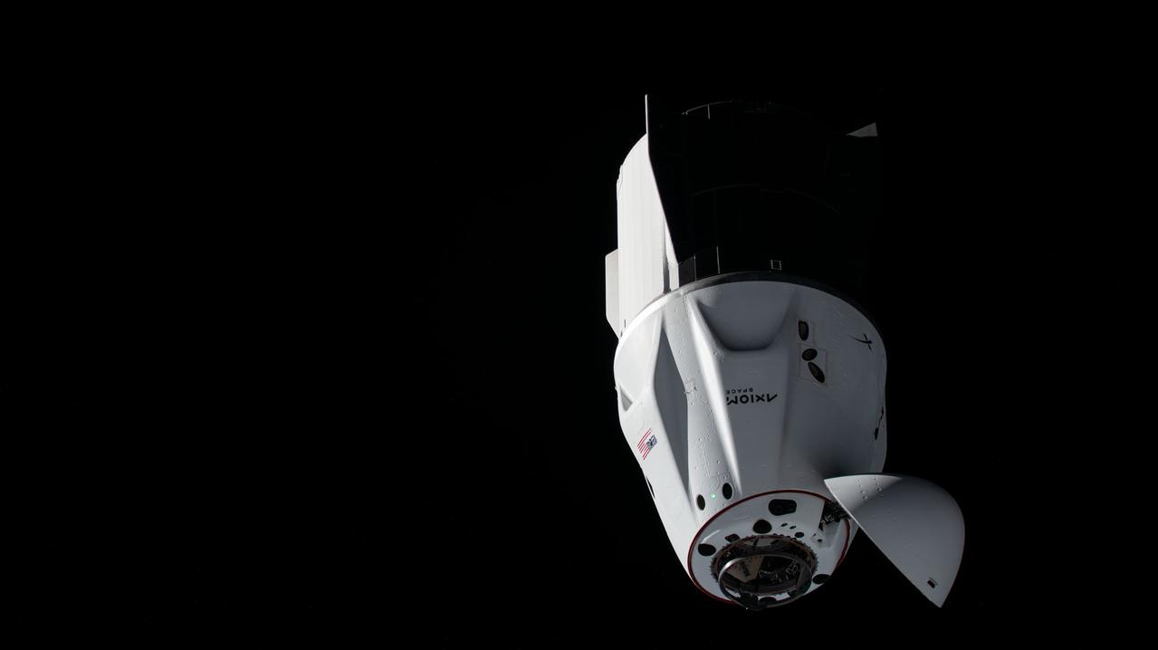 iss073e0249716 (June 26, 2025) --- The SpaceX Dragon crew spacecraft, with its nosecone open and carrying the Axiom Mission 4 crew, approaches the International Space Station before its automated docking to the orbital post's space-facing port on the Harmony module.