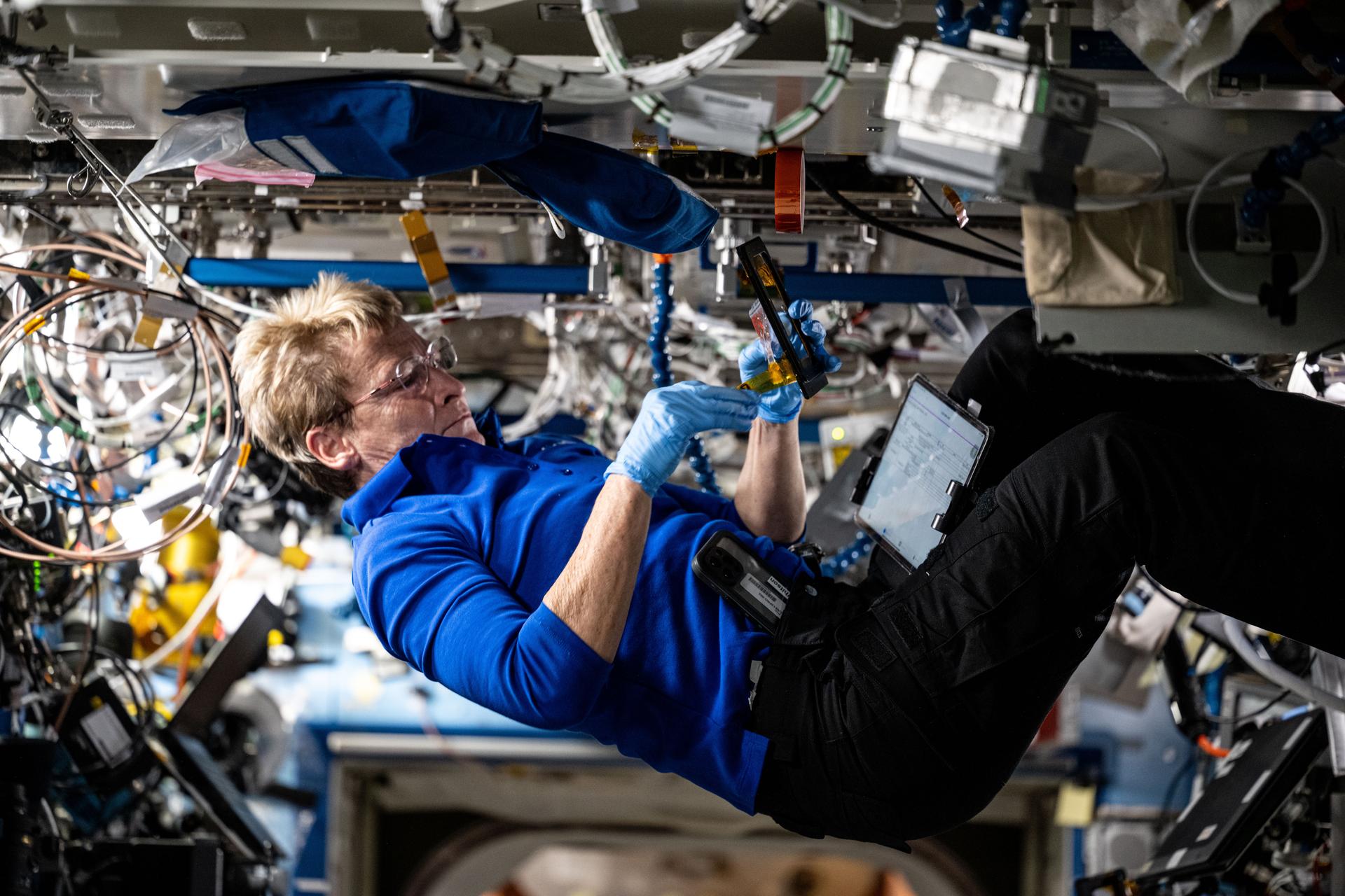 Axiom Mission 4 (Ax-4) Commander Peggy Whitson from the U.S. configures research hardware aboard the International Space Station's Destiny laboratory module.