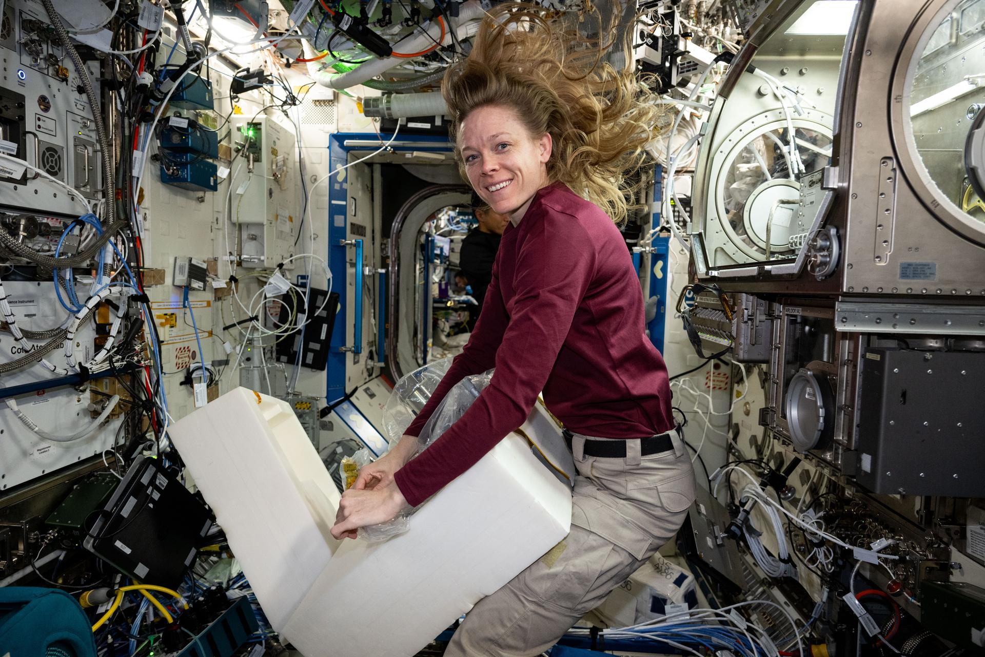 NASA astronaut and Expedition 73 Flight Engineer Nichole Ayers stows physics research hardware from inside the Microgravity Science Glovebox located inside the International Space Station's Destiny laboratory module. Ayers was completing operations with the Ring Sheared Drop investigation that may benefit pharmaceutical manufacturing techniques and 3D printing in space.
