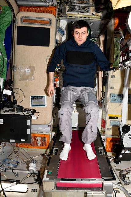 NASA image: Roscosmos cosmonaut Alexey Zubritskiy poses on the Zvezda service module's treadmill 