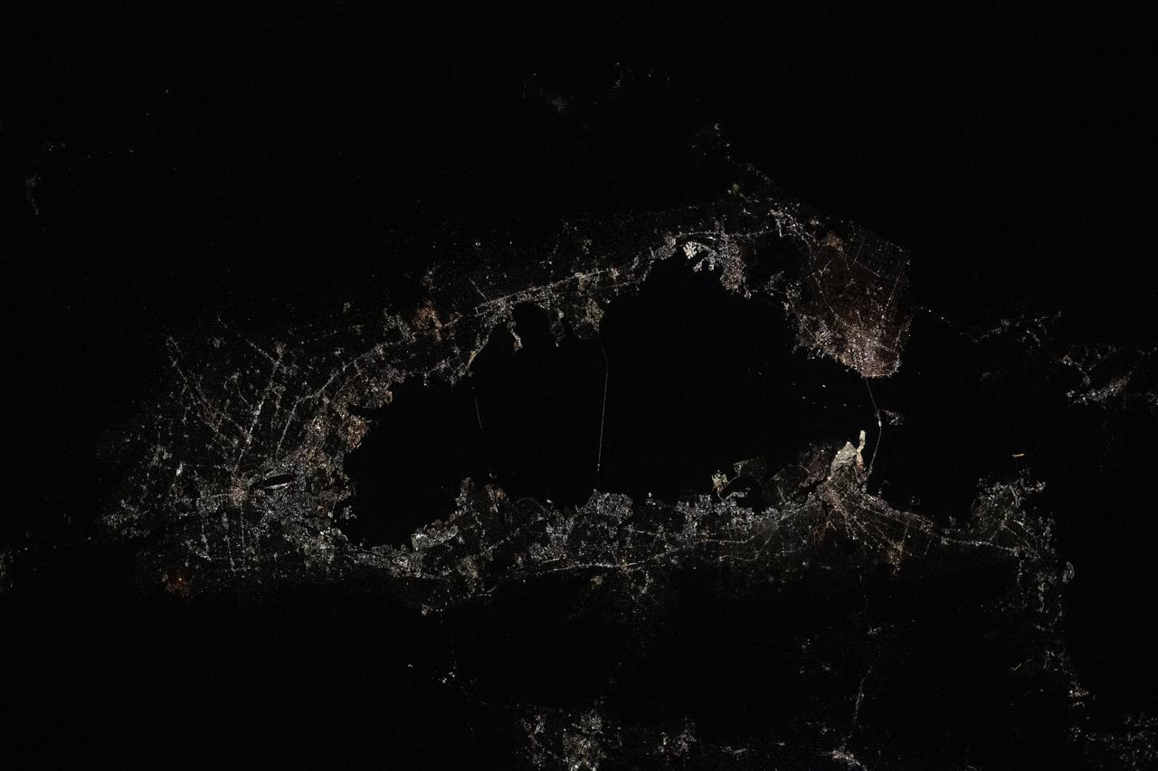 iss073e0285002 (July 4, 2025) --- The city of San Francisco, California, and its suburbs including San Jose and Oakland, surround the San Francisco Bay at approximately midnight local time in this photograph from the International Space Station as it orbited 261 miles above the Golden State.