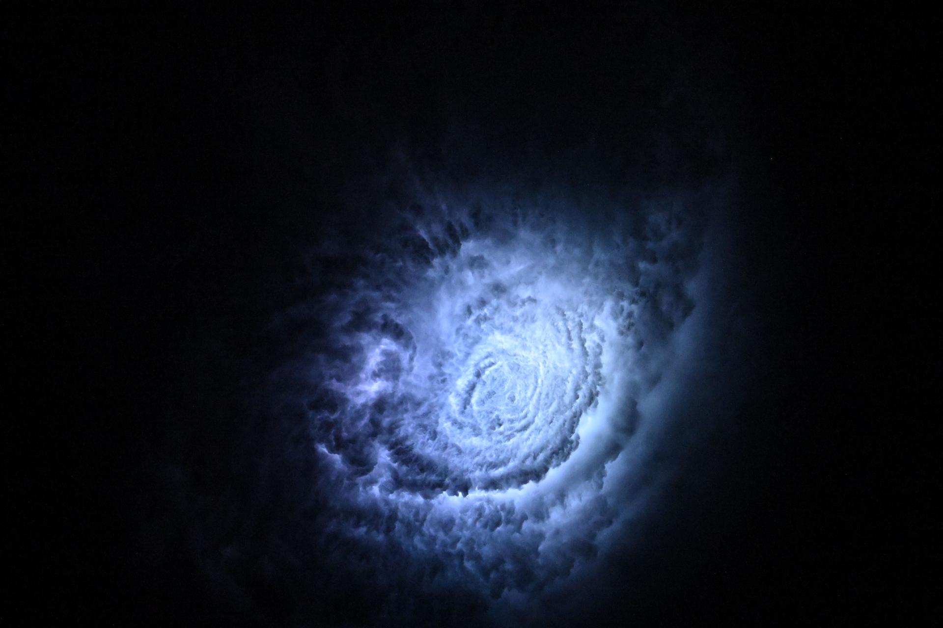 Lightning illuminates the cloud tops of Tropical Storm Erick as it stormed across the Pacific coast of central Mexico at approximately 3:38 a.m. local time as the International Space Station orbited 258 miles above.