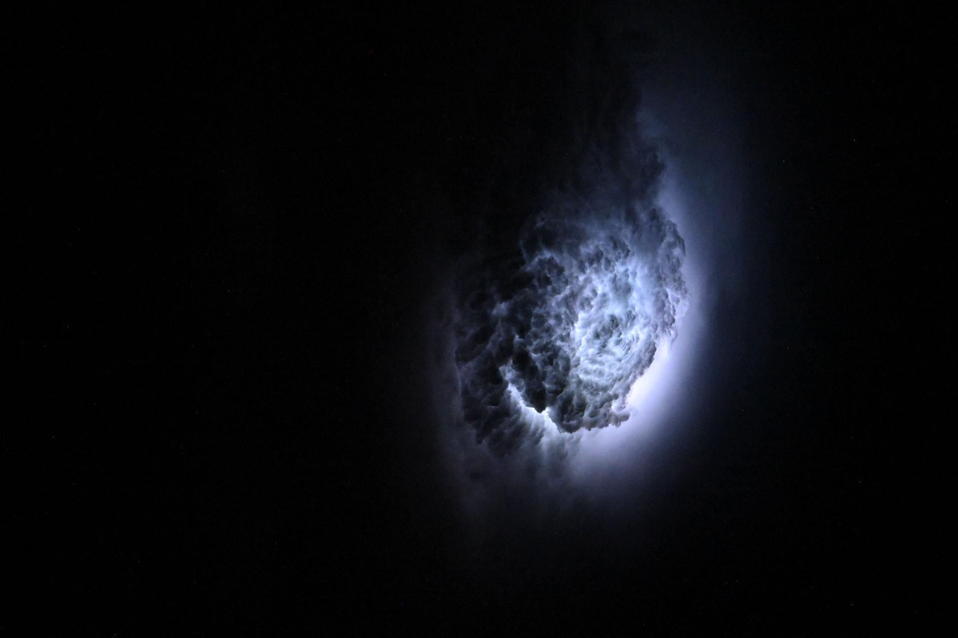 Lightning illuminates the cloud tops of Tropical Storm Erick as it stormed across the Pacific coast of central Mexico at approximately 3:42 a.m. local time as the International Space Station orbited 258 miles above.