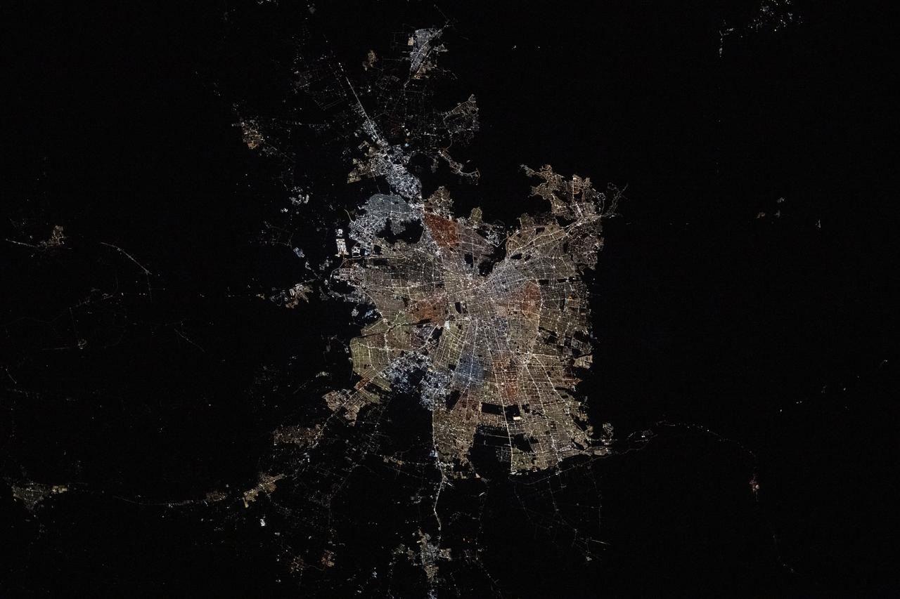 iss073e0381336 (July 18, 2025) --- Santiago, Chile, the South American nation's capital and largest city with a metropolitan population of over 6.9 million, is pictured at approximately 4:57 a.m. local time from the International Space Station as it orbited 266 miles above. Santiago rests in the Chilean Central Valley in between the Andes Mountains and the Chilean Coastal Range on the Pacific coast.