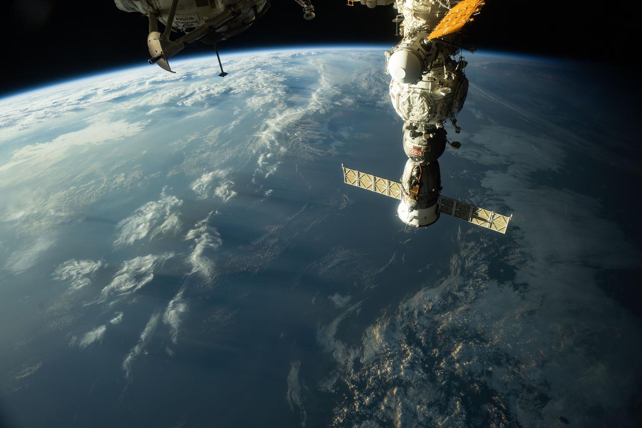 iss073e0384035 (Juny 12, 2025) --- The sunset casts long, cloudy shadows over Japan in this photograph from the International Space Station as it orbited 259 miles above the island nation. In the right foreground, the Soyuz MS-27 crew ship is docked to the Prichal module.