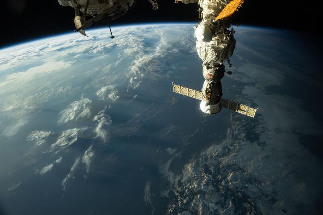 NASA image: The sunset casts long, cloudy shadows over Japan