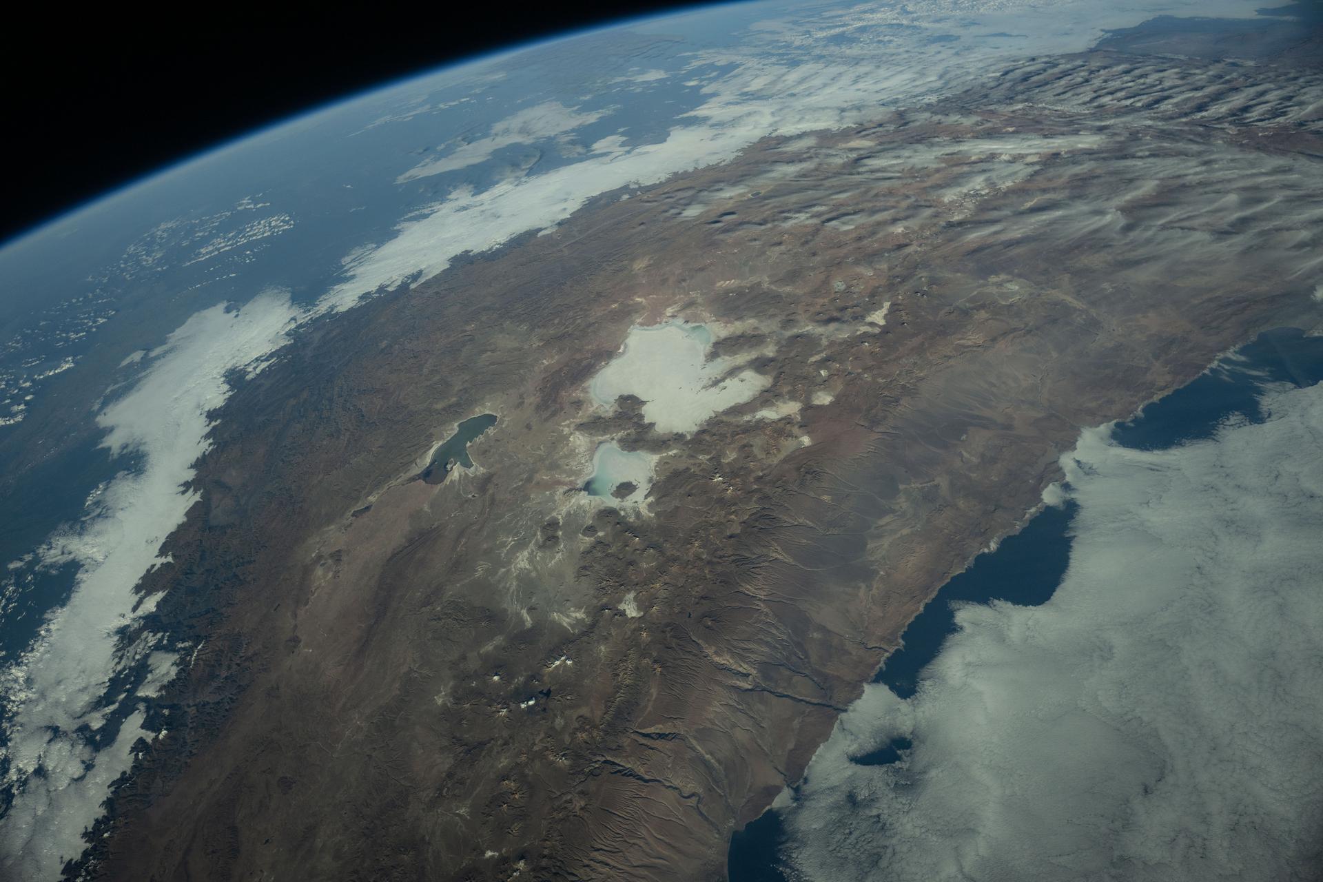 The Andes Mountains run through Chile and Bolivia on the South American continent. The eastern slope of the Andes in Bolivia captures moisture from the Amazon basin creating more rainfall on that side of the nation and contributes to an arid climate on South America's Pacific coast. The International Space Station was orbiting 260 miles above Chile when this photograph was taken.
