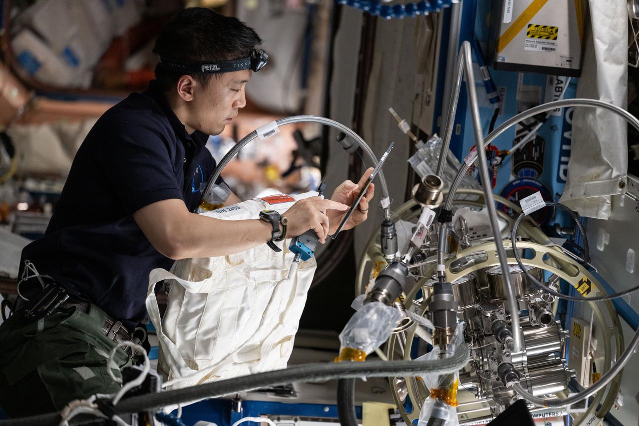 iss073e0416805 (July 25, 2025) --- NASA astronaut and Expedition 73 Flight Engineer Jonny Kim performs maintenance on the Destiny laboratory module's fluid servicer system used to maintain and repair rack water lines and systems throughout the International Space Station.