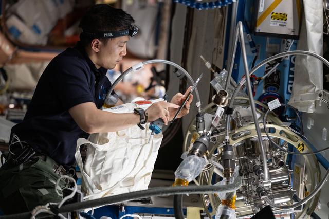 NASA image: NASA astronaut Jonny Kim performs maintenance in the Destiny laboratory module