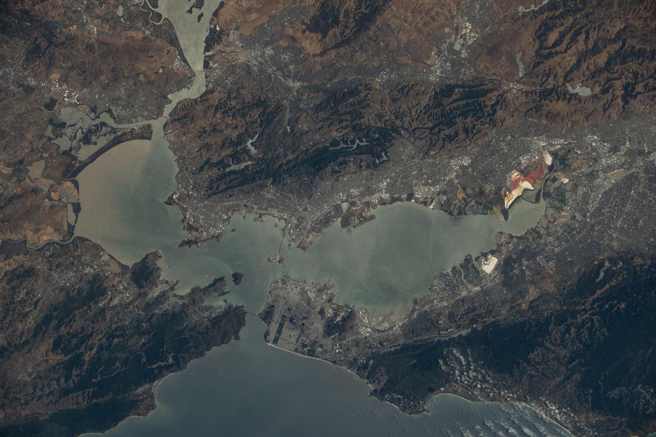 iss073e0420568 (Aug. 3, 2025) --- California's San Francisco Bay Area surrounded by the cities of San Francisico, Oakland, and San Jose, and their suburbs, is pictured from the International Space Station as it orbited 260 miles above the Golden State. Visible landmarks include the Golden Gate Bridge and the Don Edwards San Francisco Bay National Wildlife Refuge.