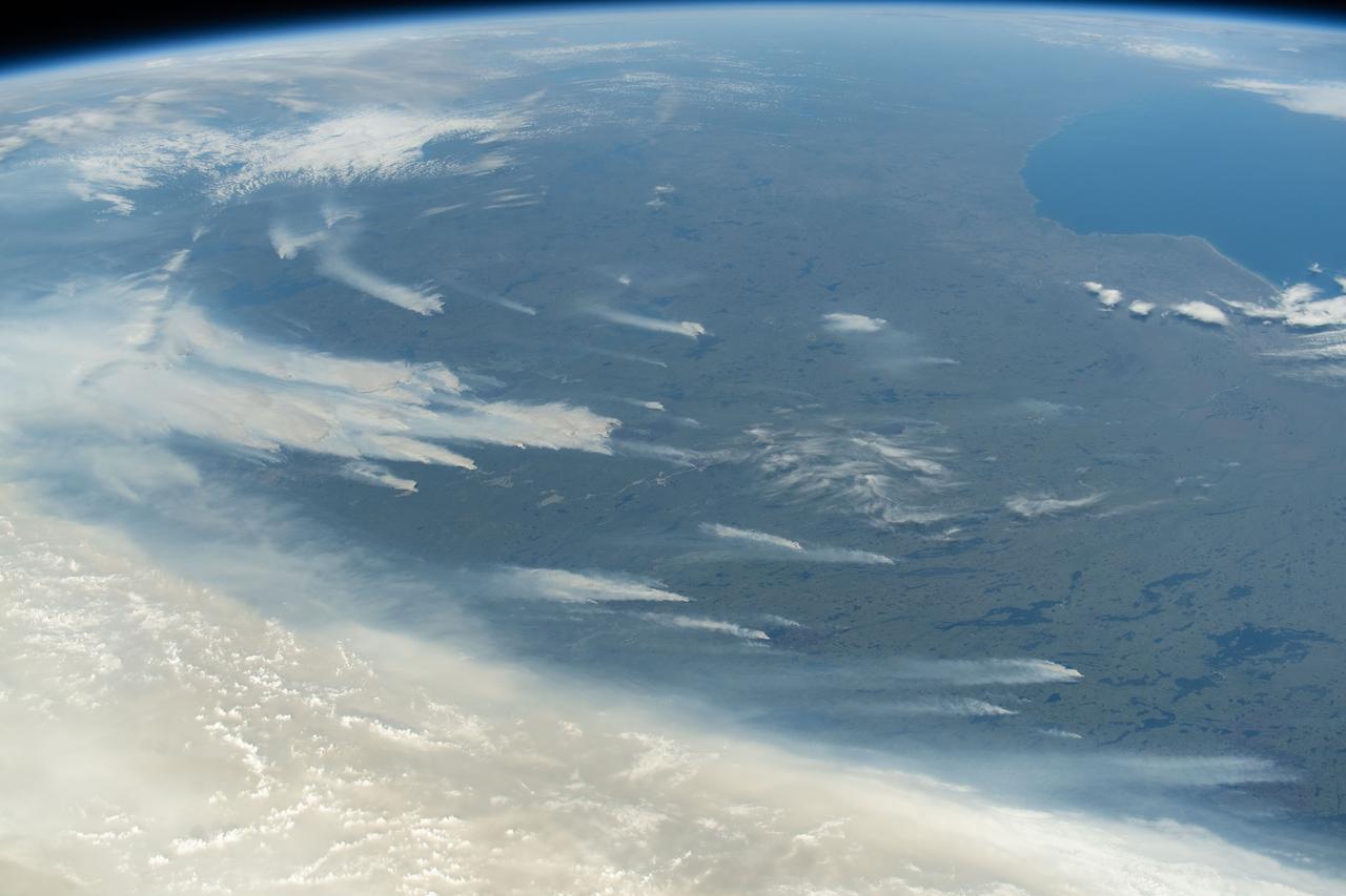 iss073e0420604 (Aug. 3, 2025) --- Wildfires burn throughout Canada's central provinces sending smoke drifitng into the United States' Great Lakes and Northeast regions impacting air quality. The International Space Station was orbiting 262 miles above Canada at the time of this photograph.