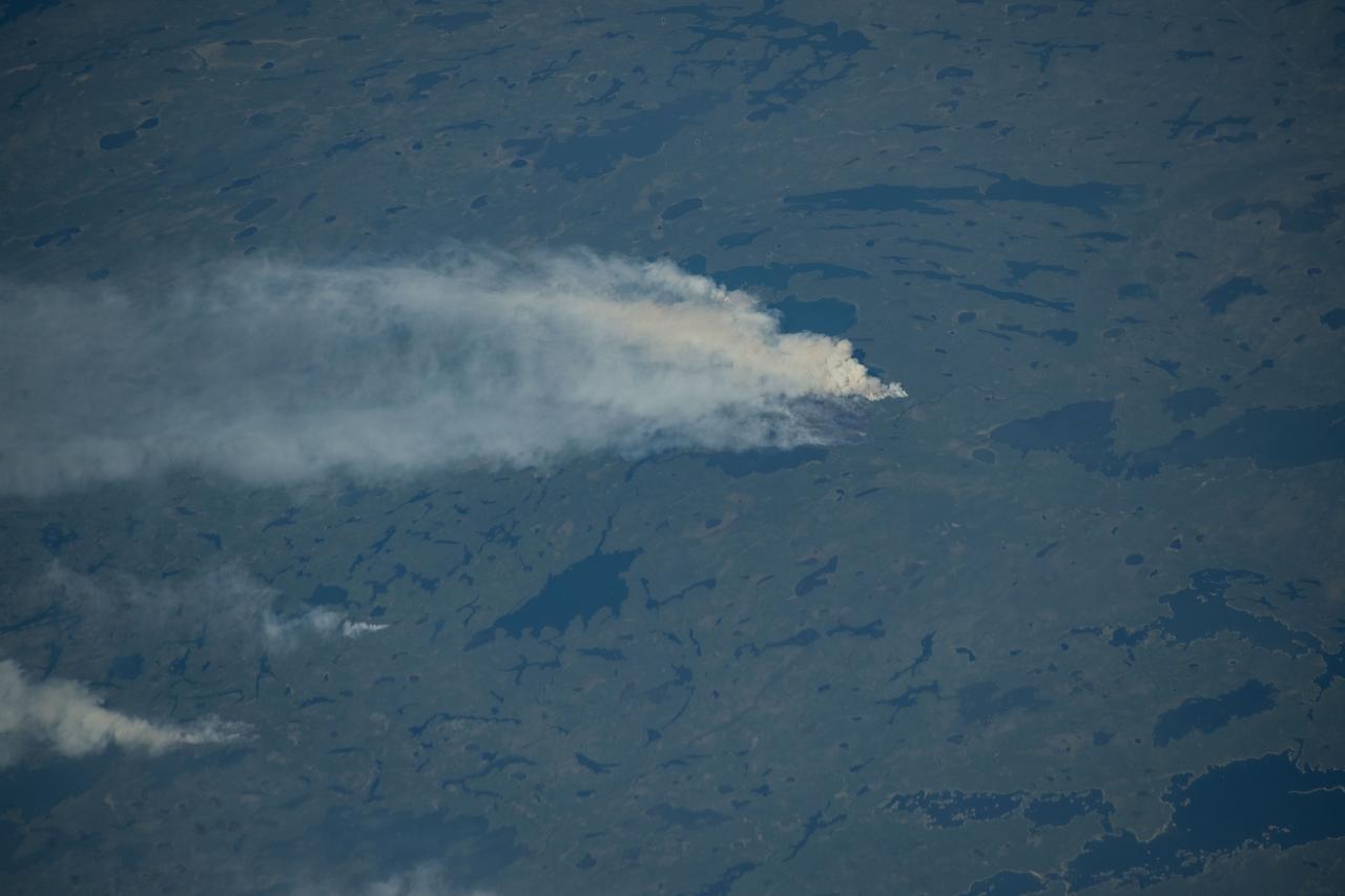 iss073e0420614 (Aug. 3, 2025) --- Wildfires burn throughout Canada's central provinces sending smoke drifitng into the United States' Great Lakes and Northeast regions impacting air quality. The International Space Station was orbiting 262 miles above Canada at the time of this photograph.
