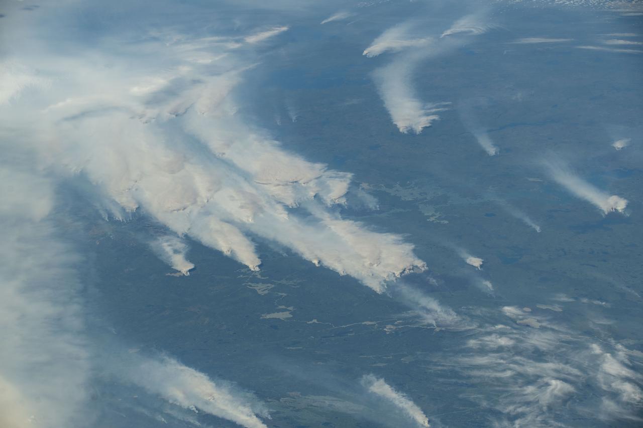 iss073e0420617 (Aug. 3, 2025) --- Wildfires burn throughout Canada's central provinces sending smoke drifting into the United States' Great Lakes and Northeast regions impacting air quality. The International Space Station was orbiting 262 miles above Canada at the time of this photograph.