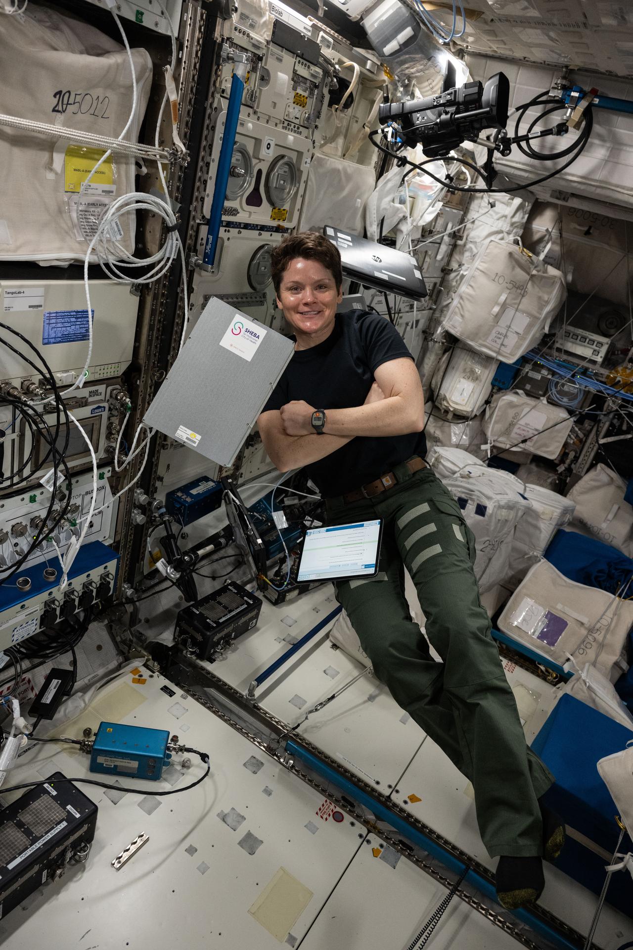 NASA astronaut and Expedition 73 Flight Engineer Anne McClain smiles for a portrait during scientific operations inside the International Space Station's Columbus laboratory module.