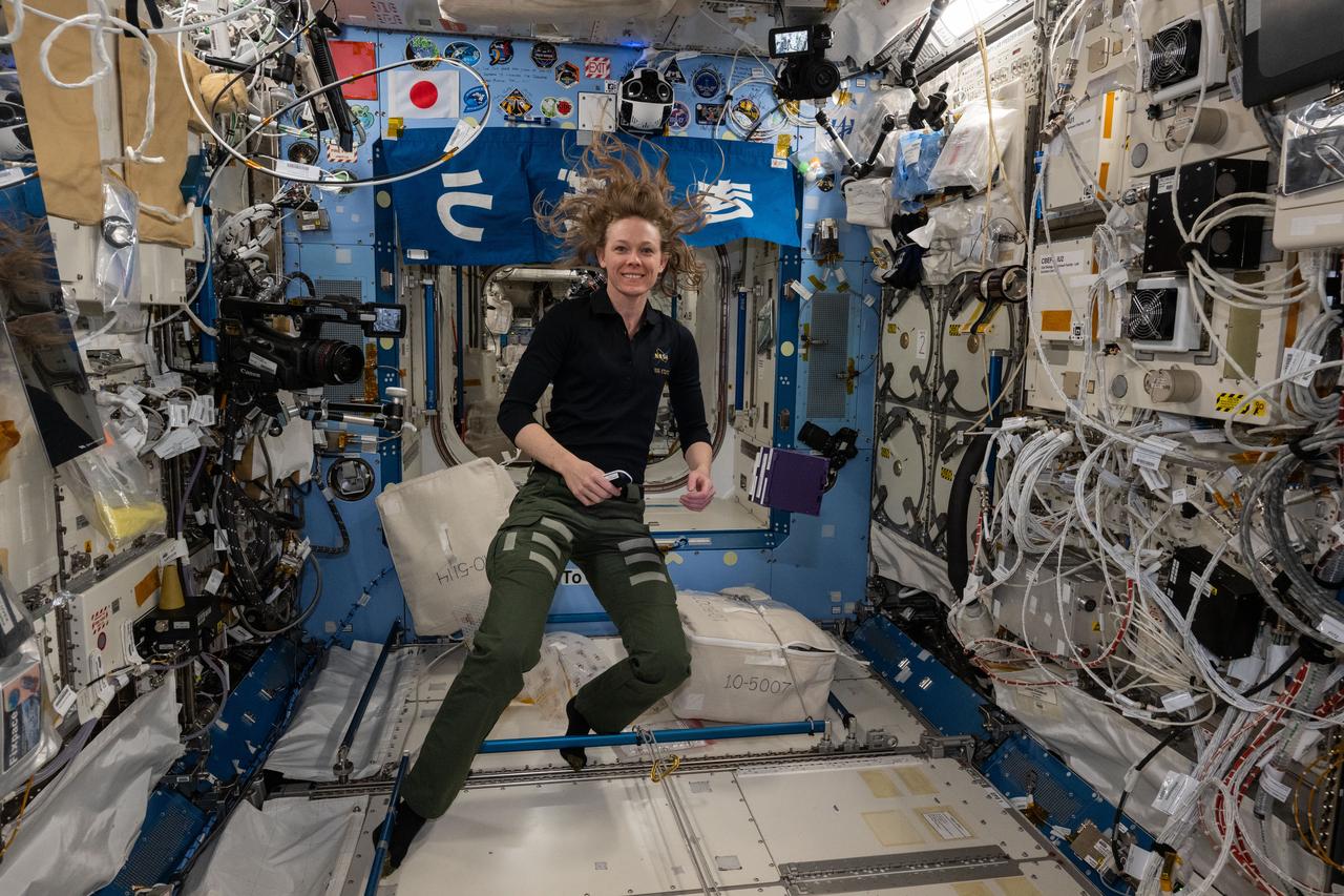 iss073e0420809 (Aug. 3, 2025) --- NASA astronaut and Expedition 73 Flight Engineer Nichole Ayers smiles for a portrait during scientific operations inside the Intenational Space Station's Kibo laboratory module.