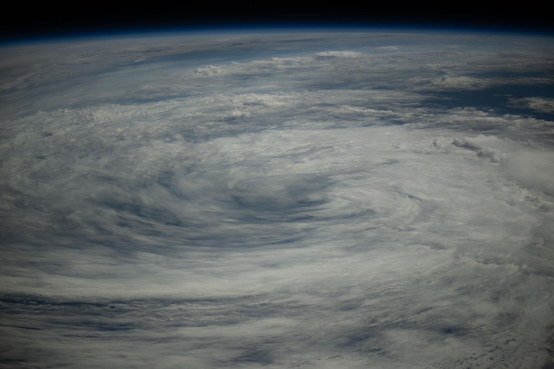 A tropical storm is pictured in the Pacific Ocean near Japan in his photograph from the International Space Station as it orbited 260 miles above.