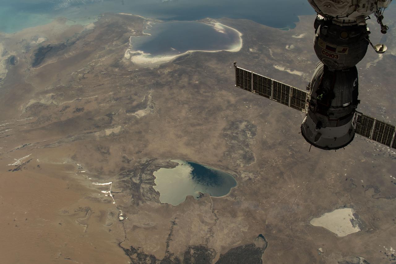 iss073e0424121 (Aug. 7, 2025) --- From top to bottom, the Caspian Sea, the Garabogazköl Basin, and Lake Sarygamysh are pictured from the International Space Station as it orbited 260 miles above Uzbekistan, a hot and dry, landlocked country in Central Asia with a population of about 37.7 million. In the foreground at top right, is the Soyuz MS-27 spacecraft docked to the Prichal module.