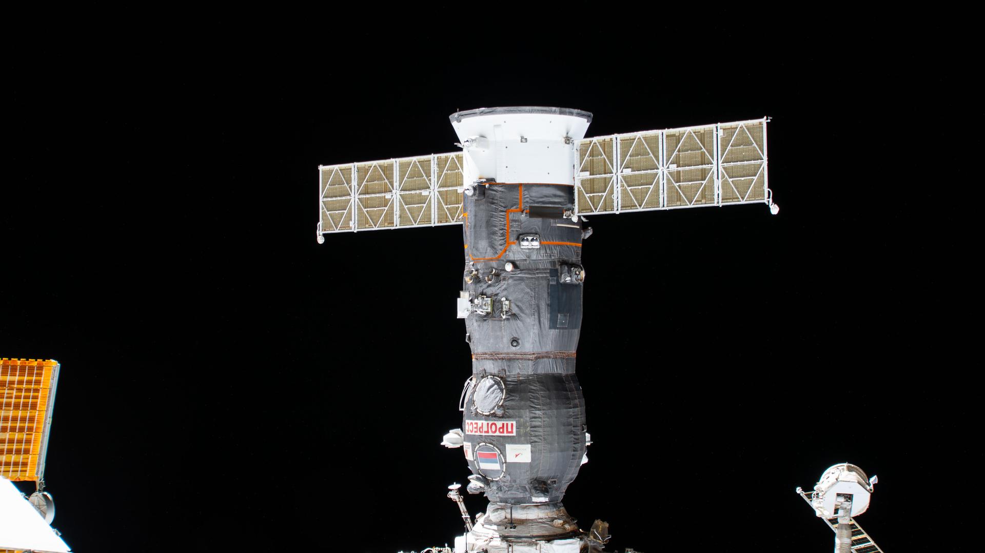 The Progress 92 cargo craft is pictured docked to the International Space Station one month after docking to the Poisk module and delivering about three tons of food, fuel, and supplies for the Expedition 73 crew.