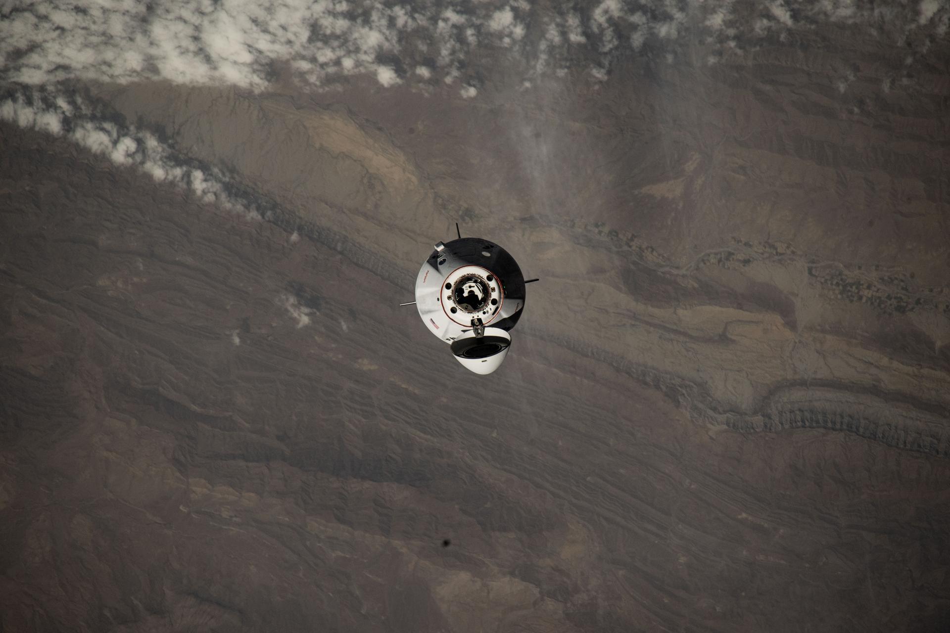 The SpaceX Dragon spacecraft carrying four members of NASA's SpaceX Crew-11 mission is pictured approaching the International Space Station 260 miles above southern Pakistan.