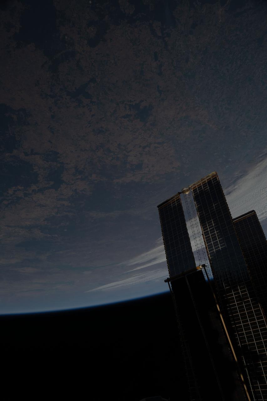 iss073e0457748 (July 4, 2025) --- The International Space Station soared 264 miles above the hot, arid region of Australia's Queensland province. At lower right, is a set of the orbital outpost's main solar arrays and a rollout solar array.