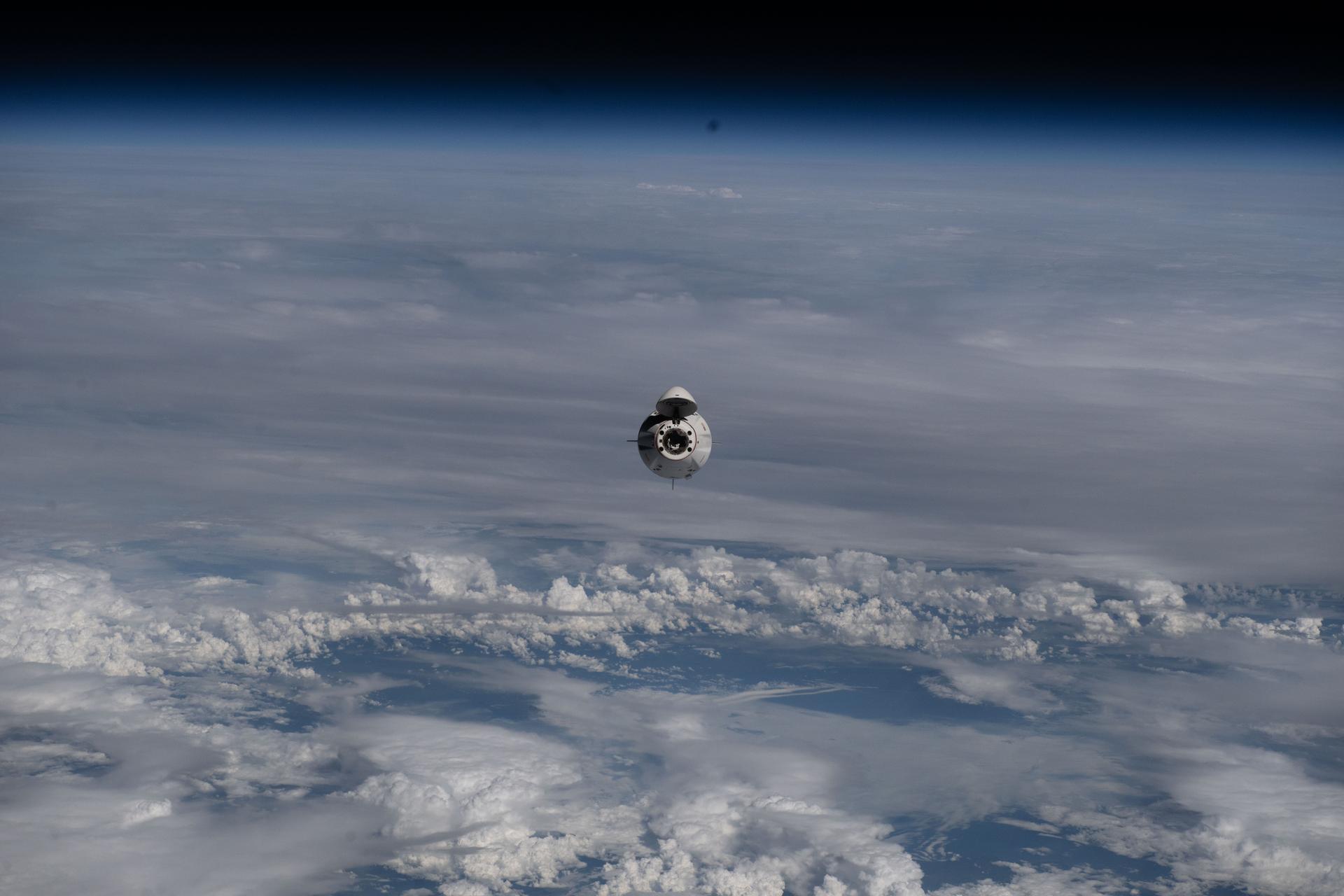 The SpaceX Dragon crew spacecraft ferrying NASA's Crew-11 mission approaches the International Space Station as both spacecraft soared 262 miles above a cloudy northeastern China.