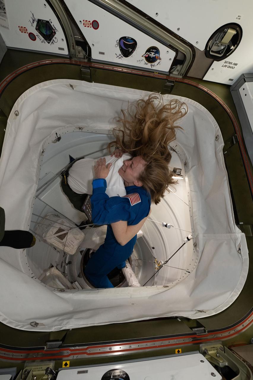 iss073e0505497 (Aug. 2, 2025) --- NASA's SpaceX Crew-11 Commander Zena Cardman is welcomed aboard the International Space Station by Expedition 73 Flight Engineer Nichole Ayers of NASA after the Dragon crew spaceraft docked to the Harmony module's space-facing port.