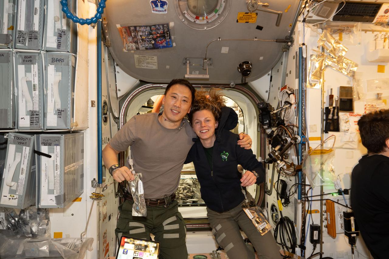 iss073e0505687 (Aug. 4, 2025) --- NASA astronauts Jonny Kim and Zena Cardman, both Expedition 73 Flight Engineers, pose for a portrait inside the International Space Station's Unity module during a break in weekend housecleaning and maintenance activities. Kim and Cardman are both part of NASA Astronaut Group 22 selected in June 2017 with 12 other astronauts, including two Canadian Space Agency astronauts, and affectionately nicknamed "The Turtles."