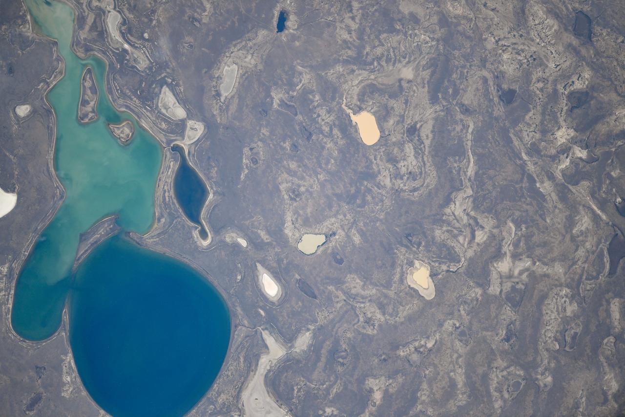 iss073e0510437 (Aug. 19, 2025) --- A lake in the sparsely populated, semi-arid Zhangeldin region of Kazakhstan is pictured from the International Space Station as it orbited 263 miles above the Central Asian nation. Many lakes in Kazakhstan are seasonal and exhibit cyclical drying and refilling patterns or temprarily appear after snowmelt or heavy rains. Credit: Roscosmos