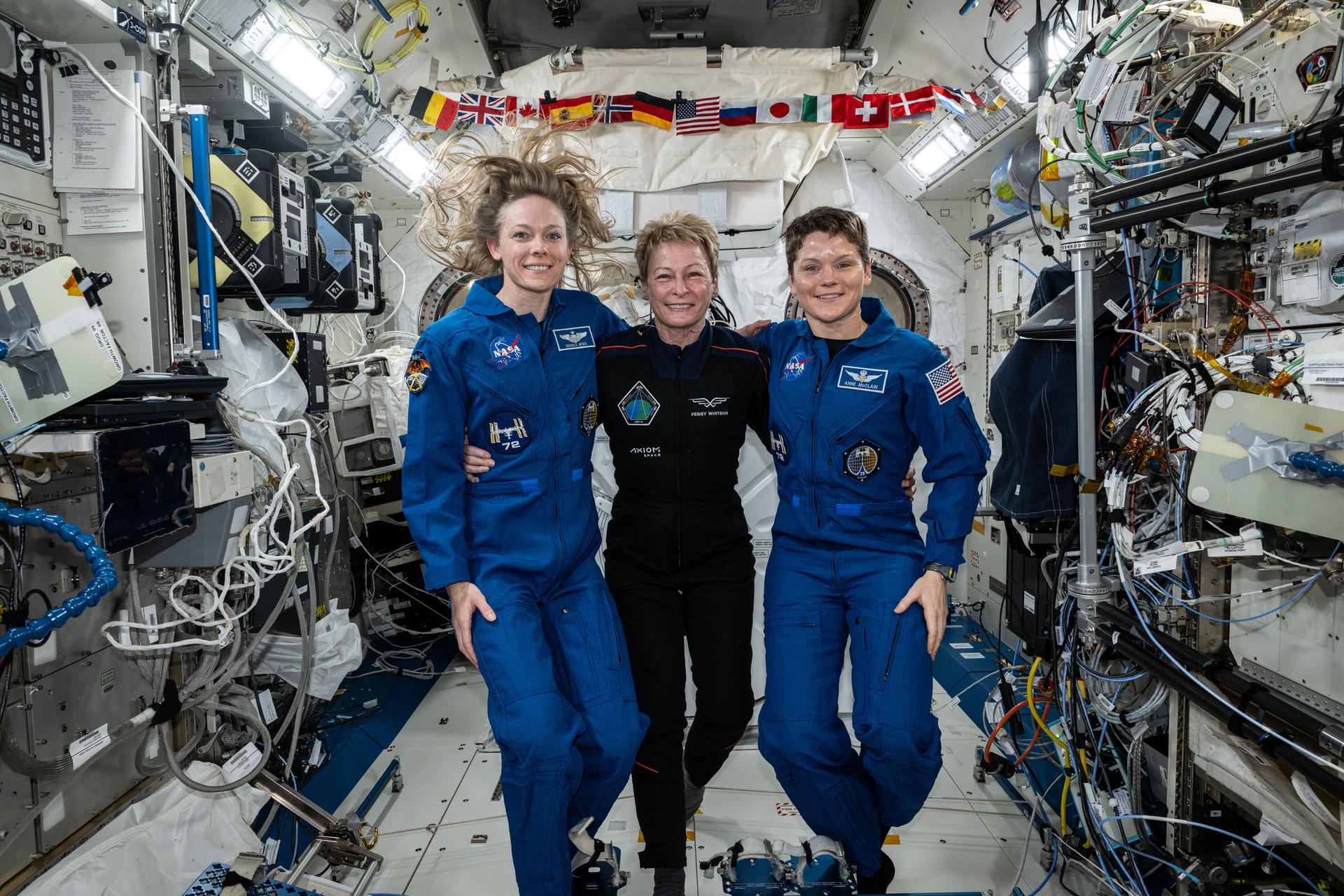 Axiom Mission 4 Commander Peggy Whitson and Expedition 73 Flight Engineer Jonny Kim from NASA pose together for portrait taken inside the International Space Station's Kibo laboratory module.