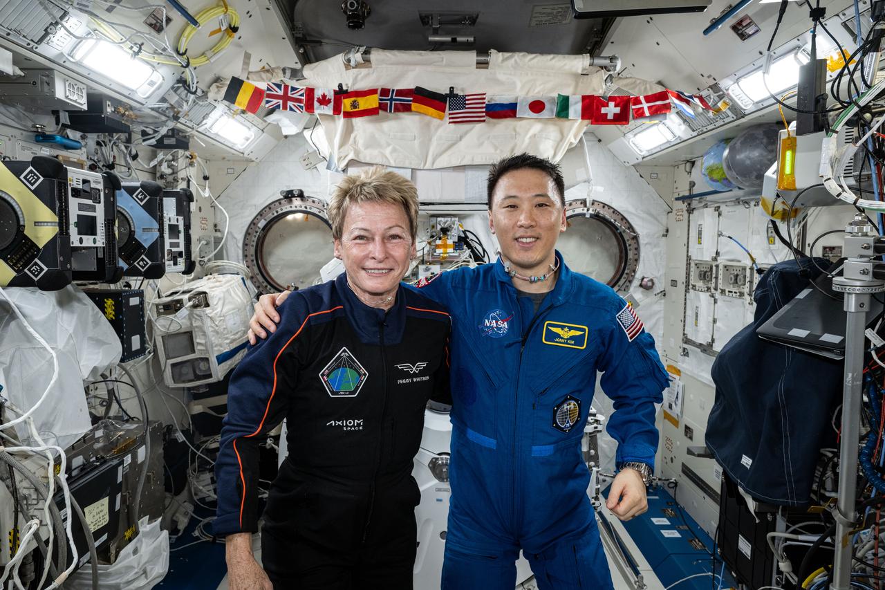 iss073e0511155 (July 3, 2025) --- Axiom Mission 4 Commander Peggy Whitson and Expedition 73 Flight Engineer Jonny Kim from NASA pose together for portrait taken inside the International Space Station's Kibo laboratory module.