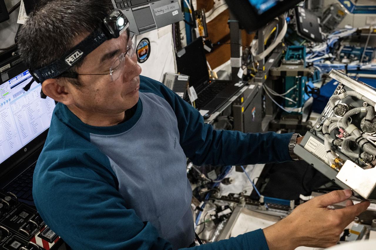 iss073e0511308 (Aug. 19, 2025) --- JAXA (Japan Aerospace Exploration Agency) astronaut and Expedition 73 Flight Engineer Kimiya Yui checks out a Global Positioning Satellite receiver during maintenance aboard the International Space Station's Destiny laboratory module.