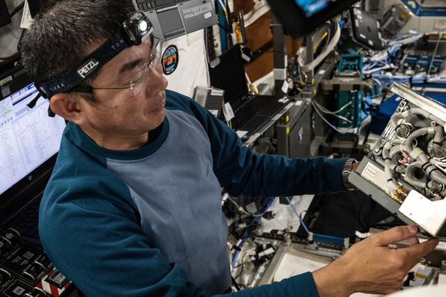 NASA image: JAXA astronaut Kimiya Yui checks out a Global Positioning Satellite receiver