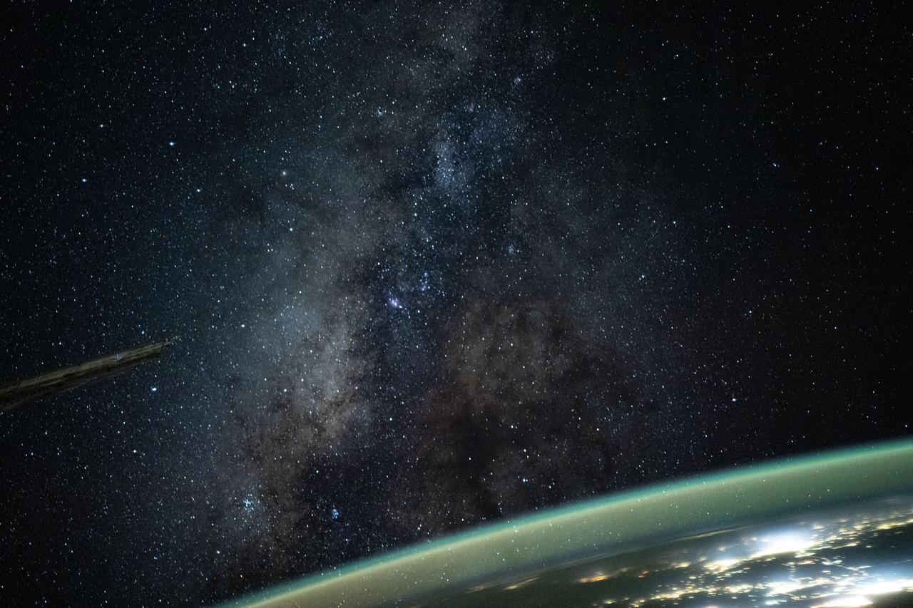 iss073e0516005 (Aug. 23, 2025) --- The Milky Way appears above Earth's bright atmospheric glow in this photograph from the International Space Station as it soared 261 miles above southern Iran at approximately 12:54 a.m. local time. The camera was configured for low light and long duration settings.